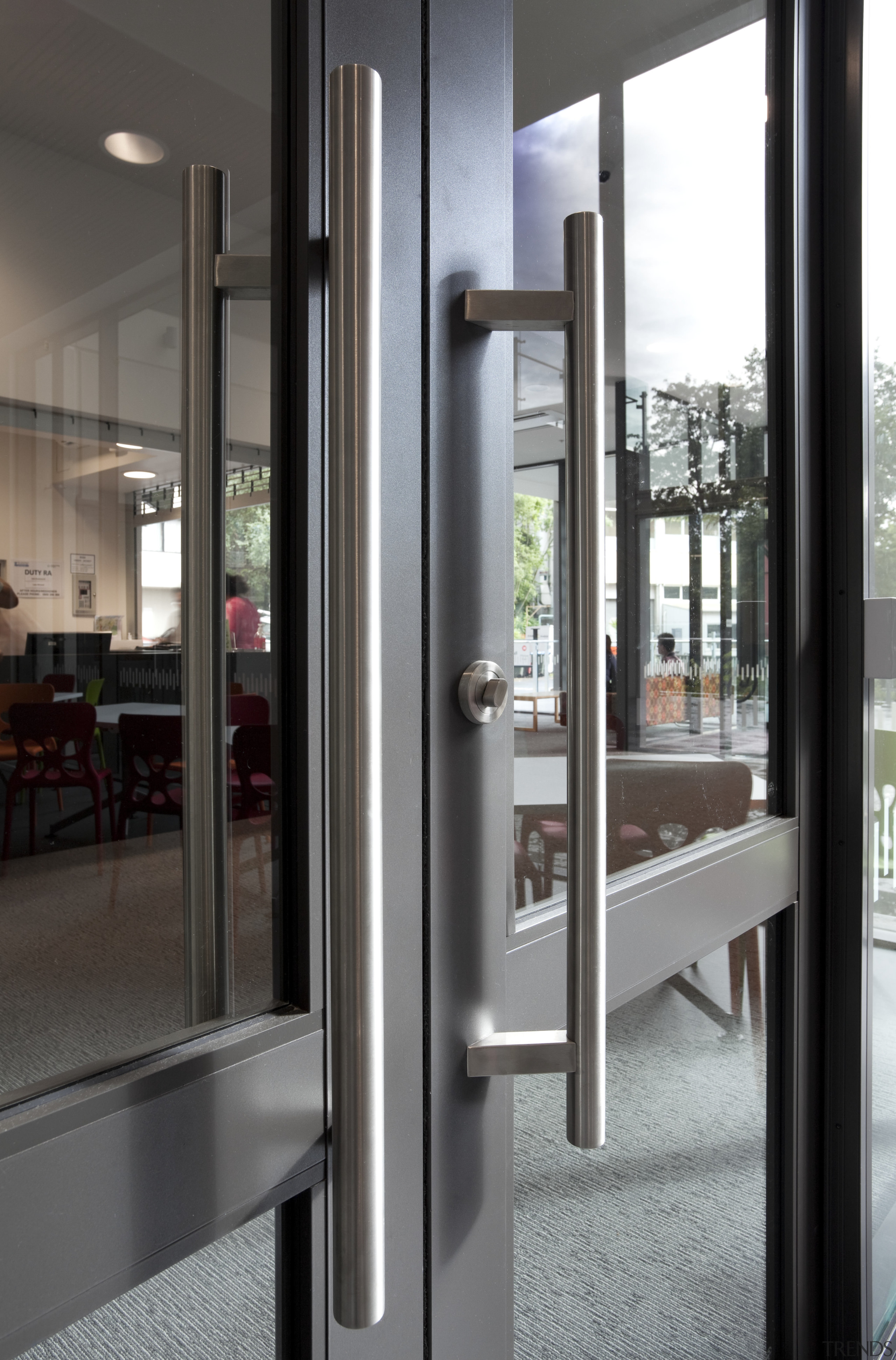 View of door handle. - View of door door, structure, gray, black