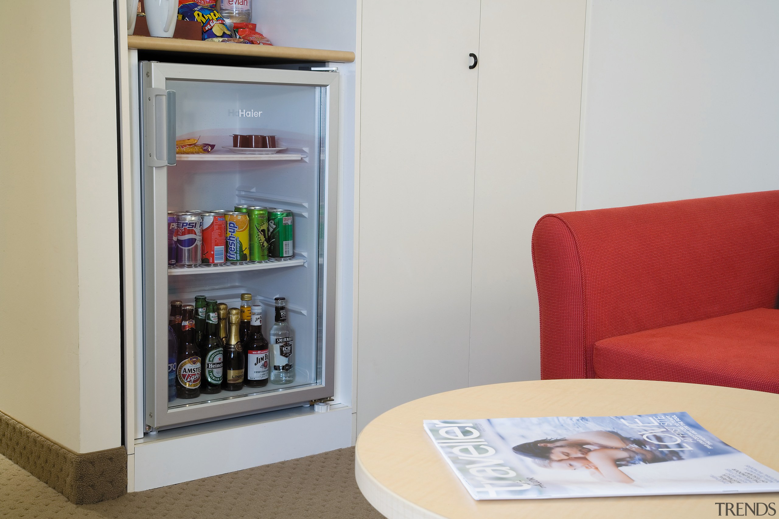 A view of a Haier mini fridge. - furniture, home appliance, product, refrigerator, shelf, shelving, gray