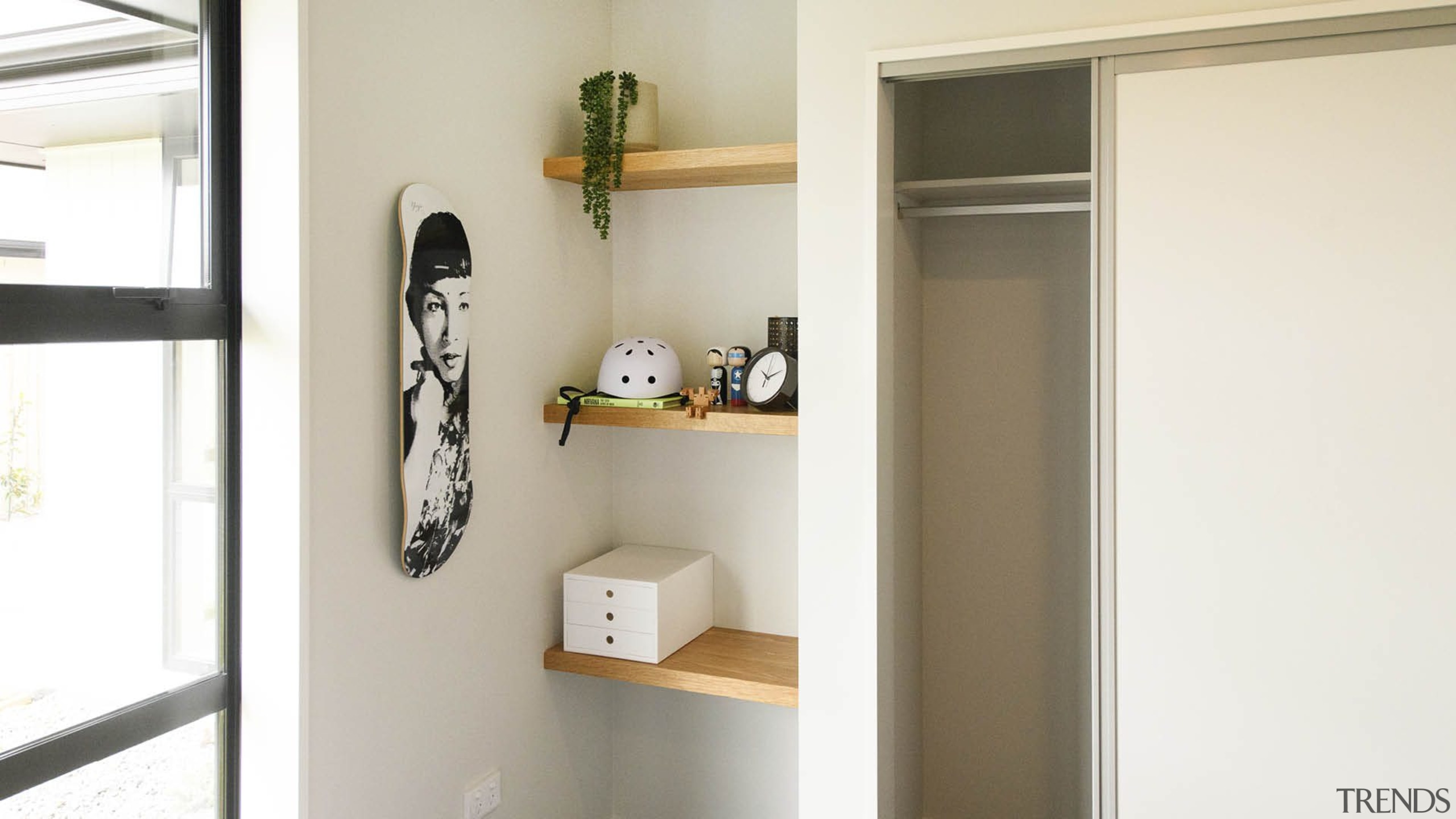 A children's bedroom with built in wardrobe and 