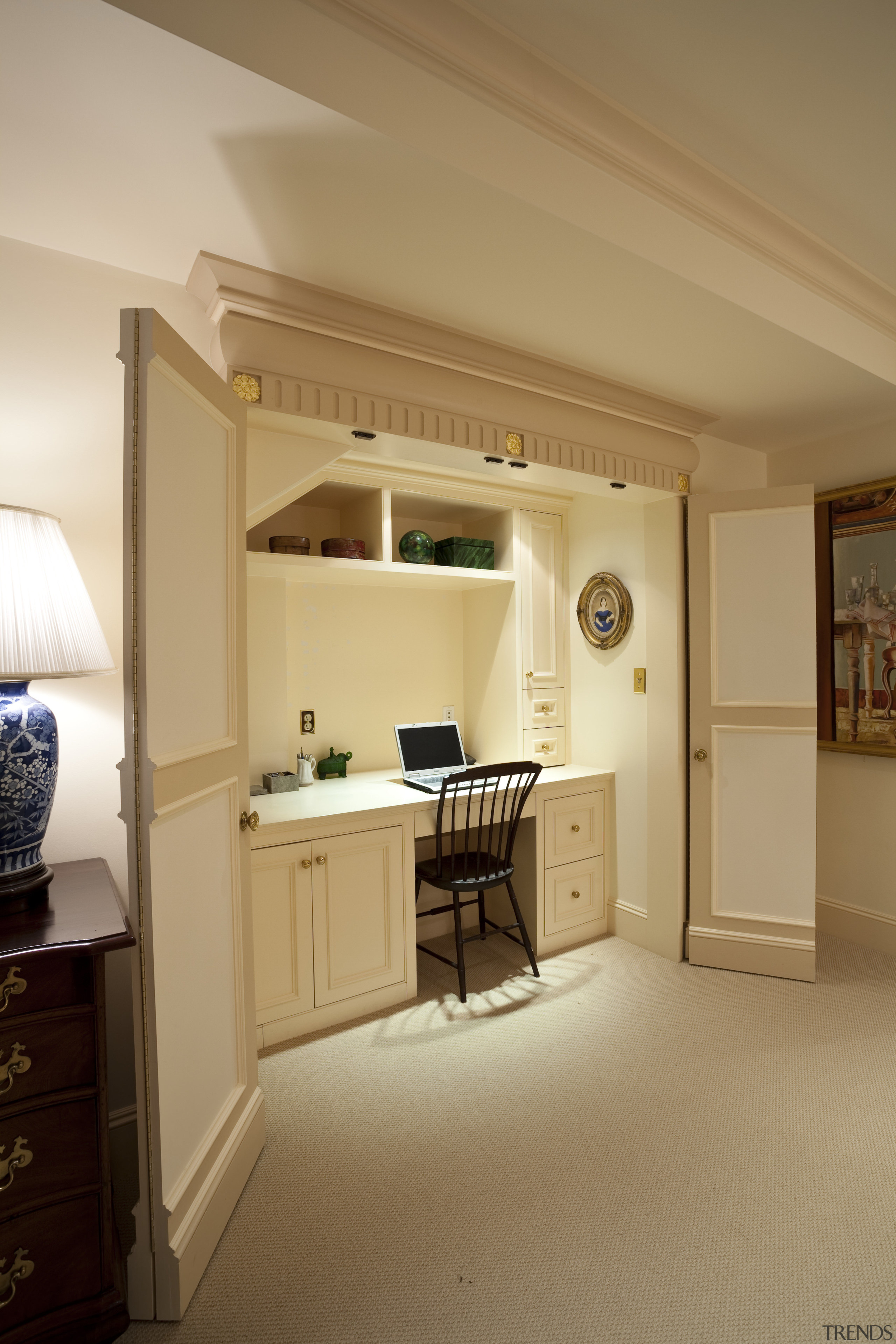 View of desk area under a staircase. - cabinetry, ceiling, floor, flooring, furniture, home, interior design, kitchen, room, wall, orange, brown