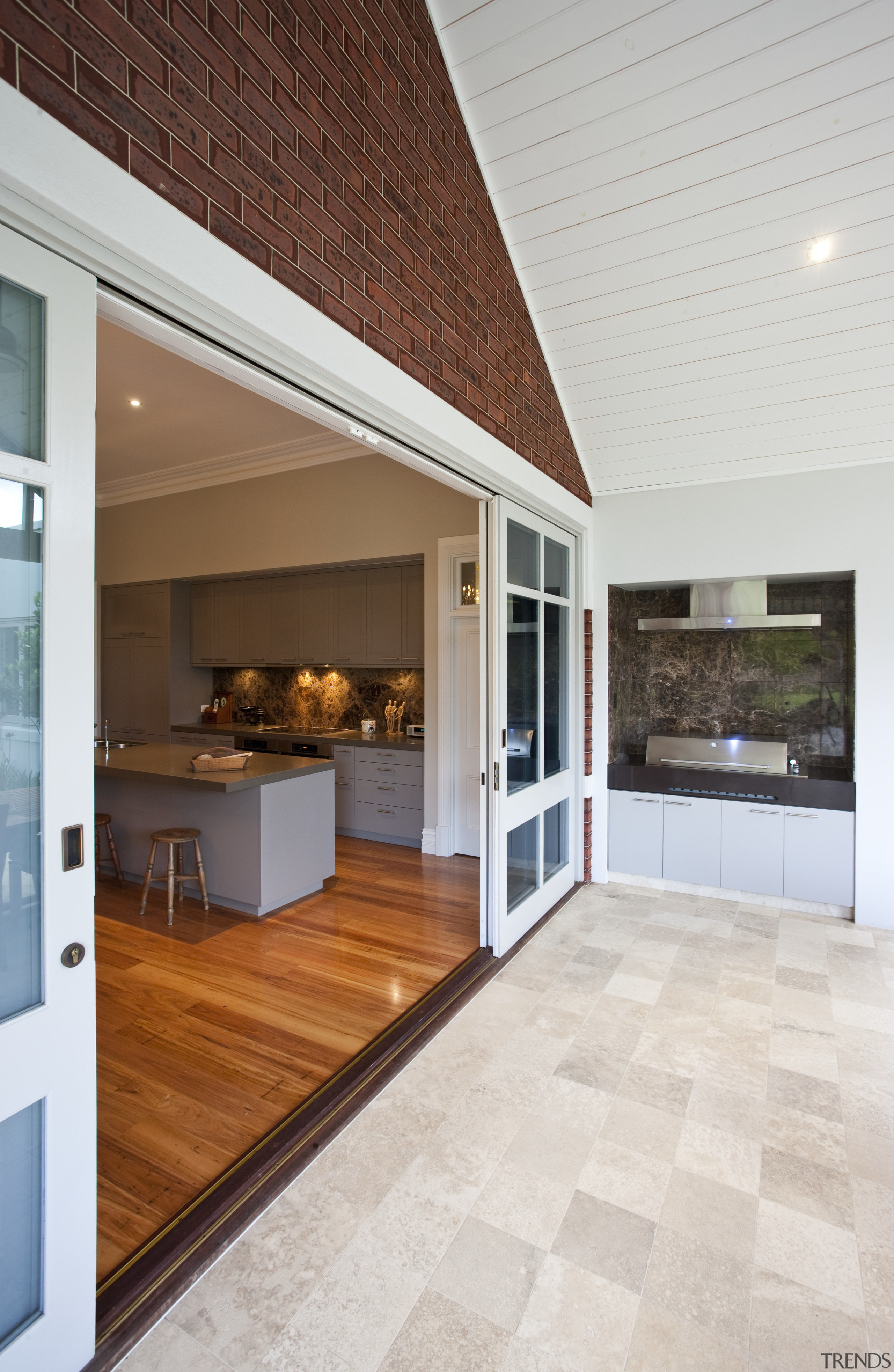 View of BBQ set in the covered deck ceiling, countertop, floor, flooring, hardwood, house, interior design, kitchen, laminate flooring, living room, real estate, window, wood flooring, white, brown