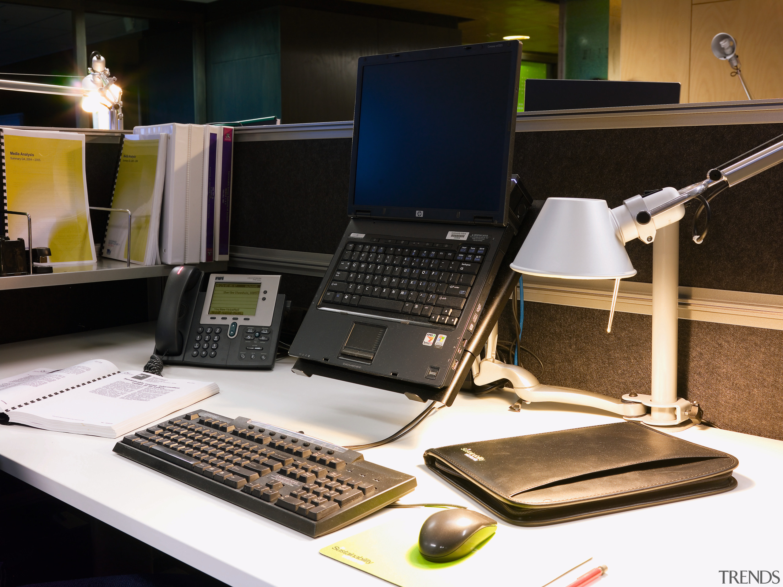 A view of this desk featuring laptop, phone, desktop computer, electronic device, furniture, laptop, netbook, personal computer, product, product design, technology, black