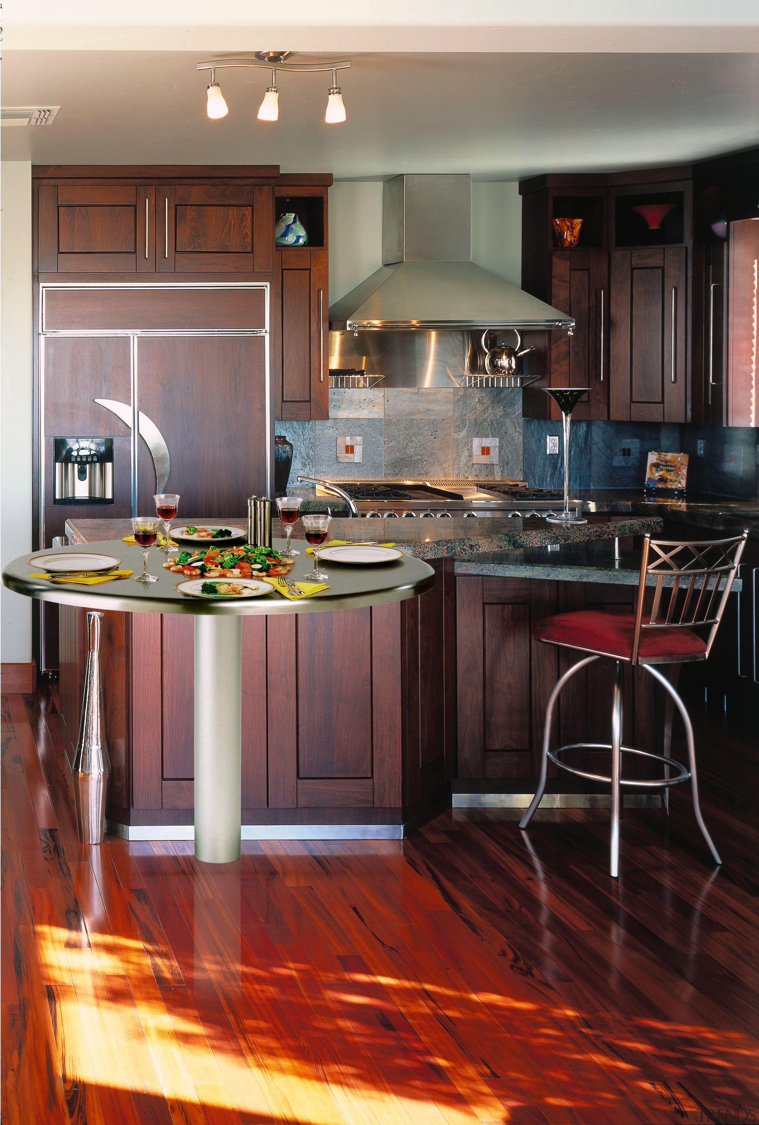 view of this kitchen featuring a cook-n-dine stainless cabinetry, countertop, cuisine classique, floor, flooring, hardwood, interior design, kitchen, laminate flooring, room, wood, wood flooring, black