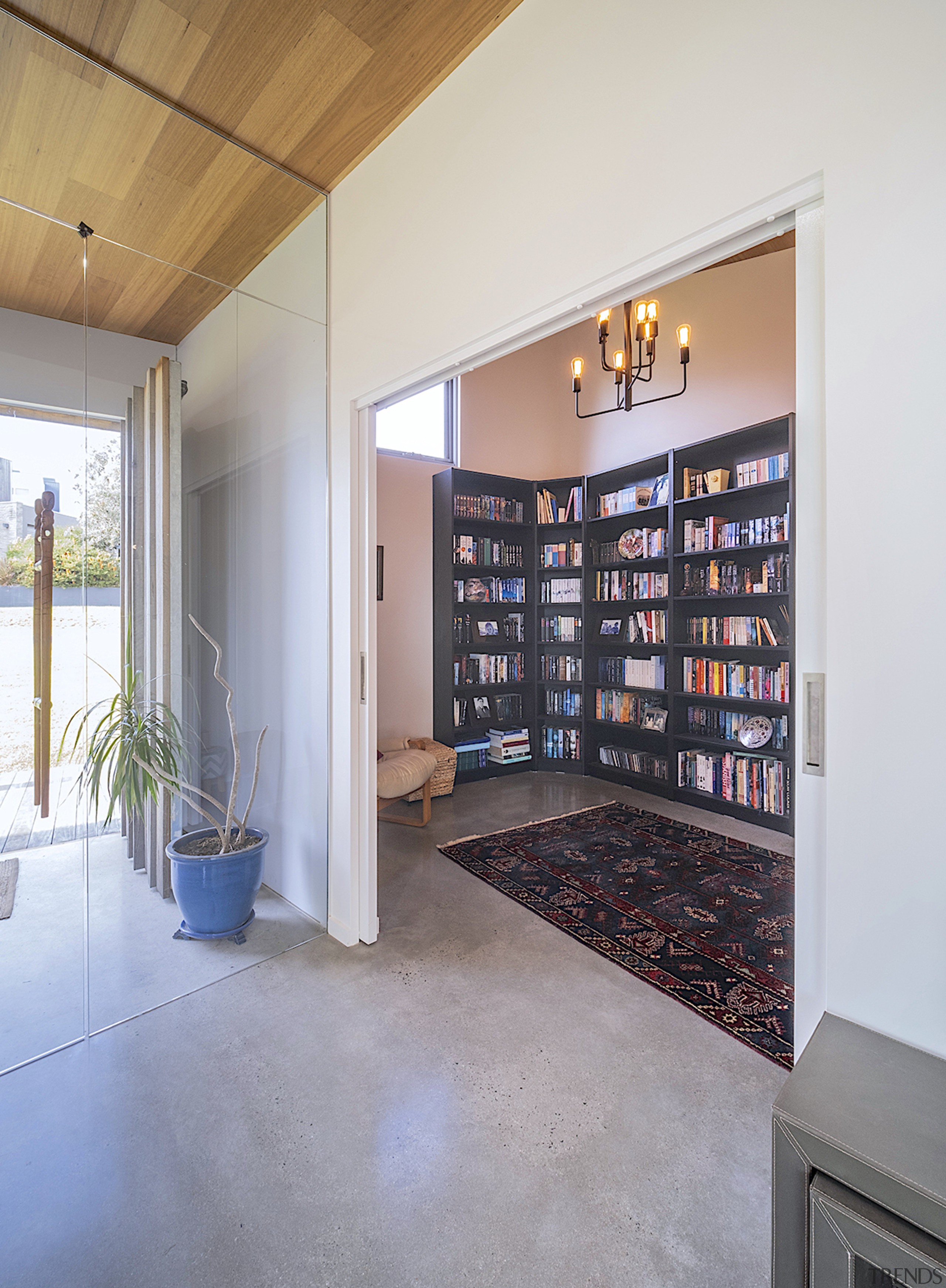 The upper level entry and adjacent dedicated library 