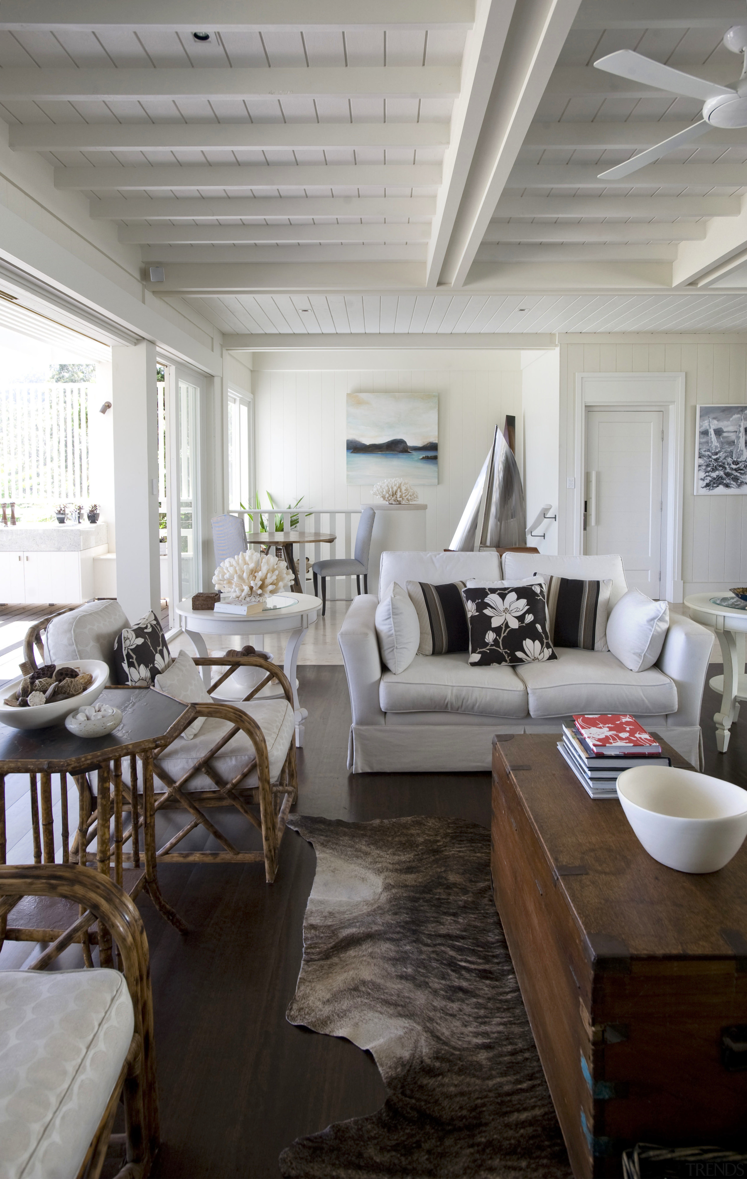 Interior view of a Sydney beach house by ceiling, floor, home, interior design, living room, room, table, gray