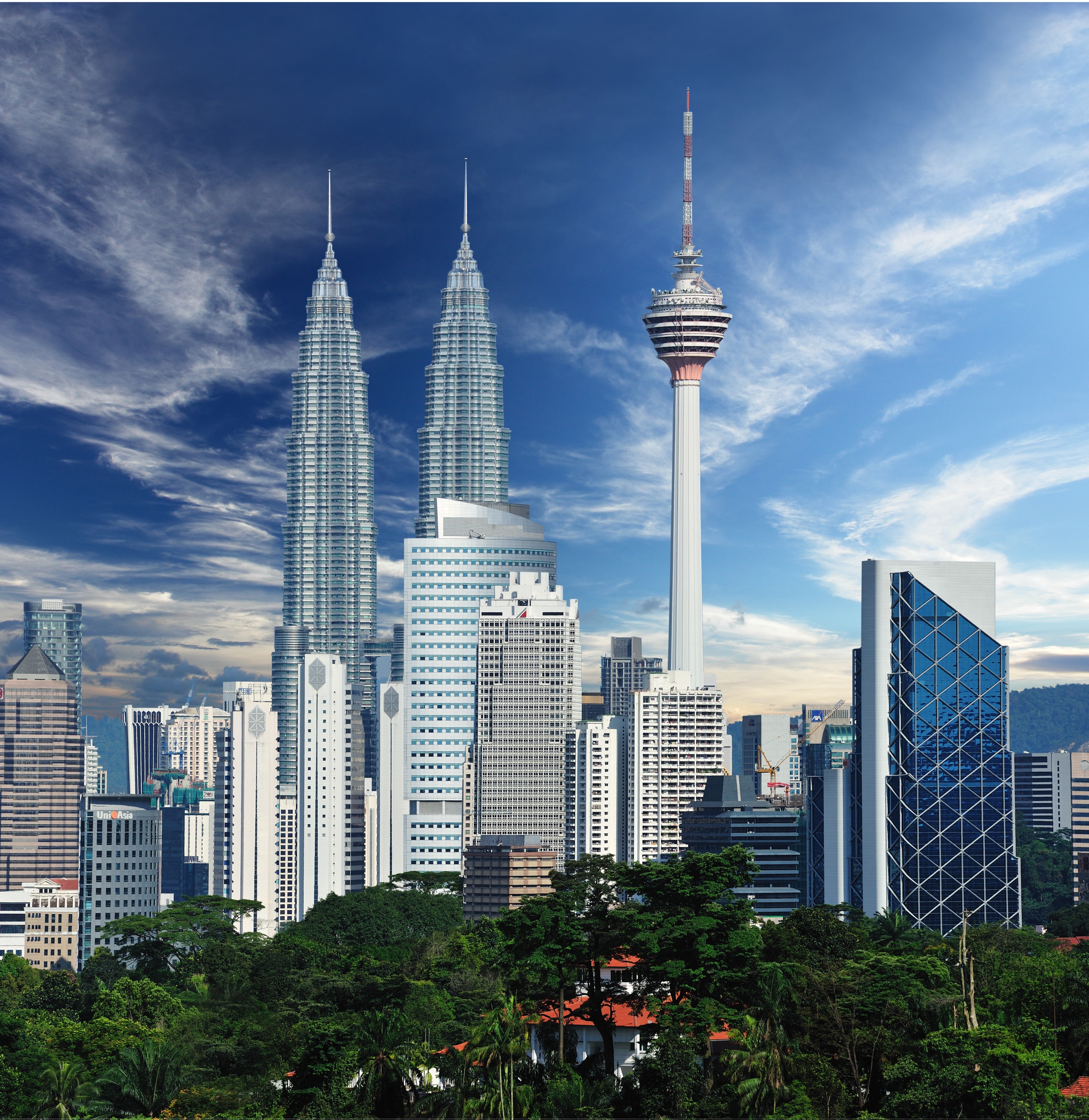 The new Menara Bumiputra Commerce tower is appropriate building, city, cityscape, cloud, condominium, daytime, downtown, landmark, metropolis, metropolitan area, sky, skyline, skyscraper, tourist attraction, tower, tower block, urban area, blue
