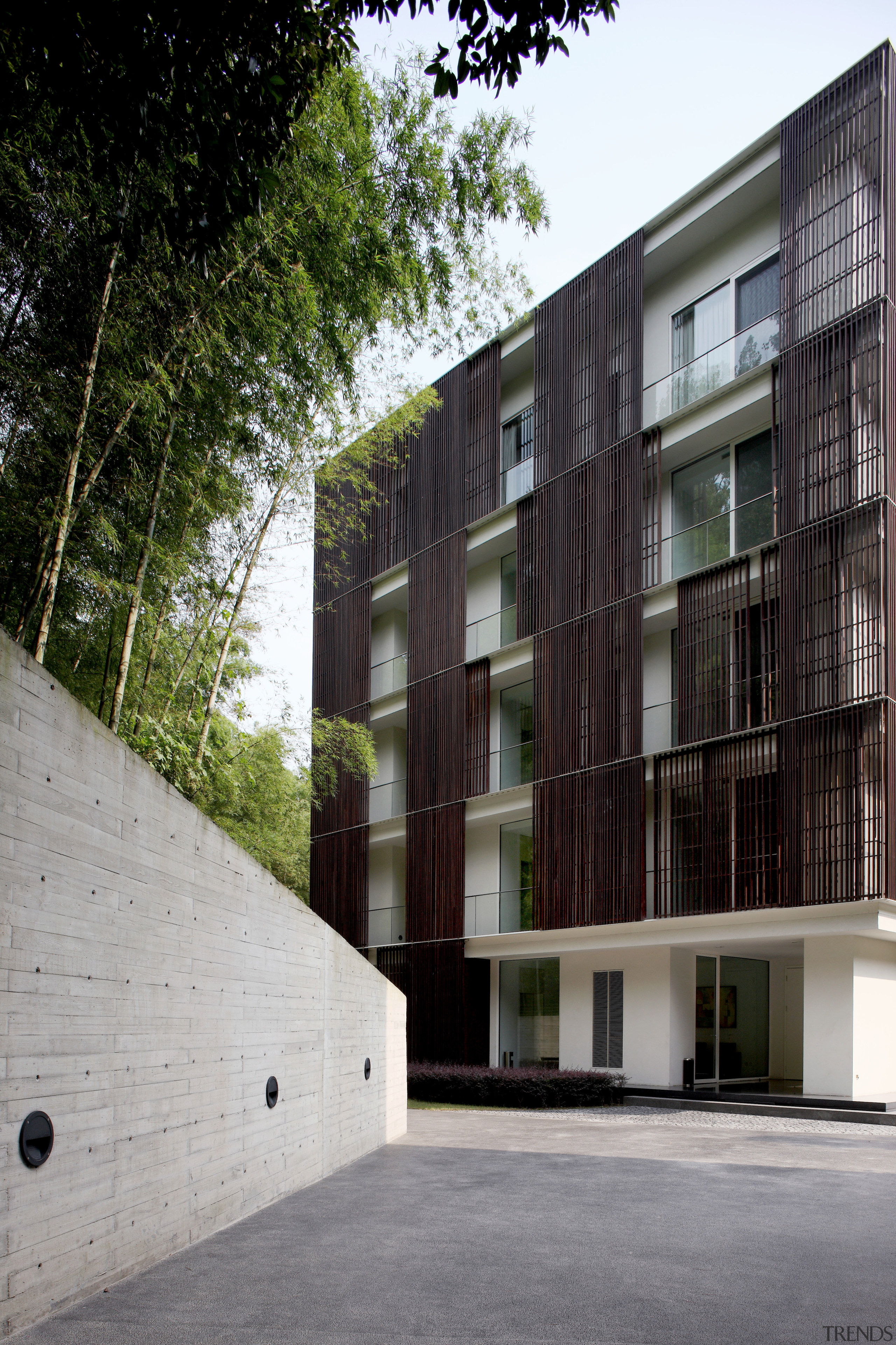 Exterior view of an apartment building which features apartment, architecture, building, condominium, facade, house, mixed use, neighbourhood, real estate, residential area, window, gray, black