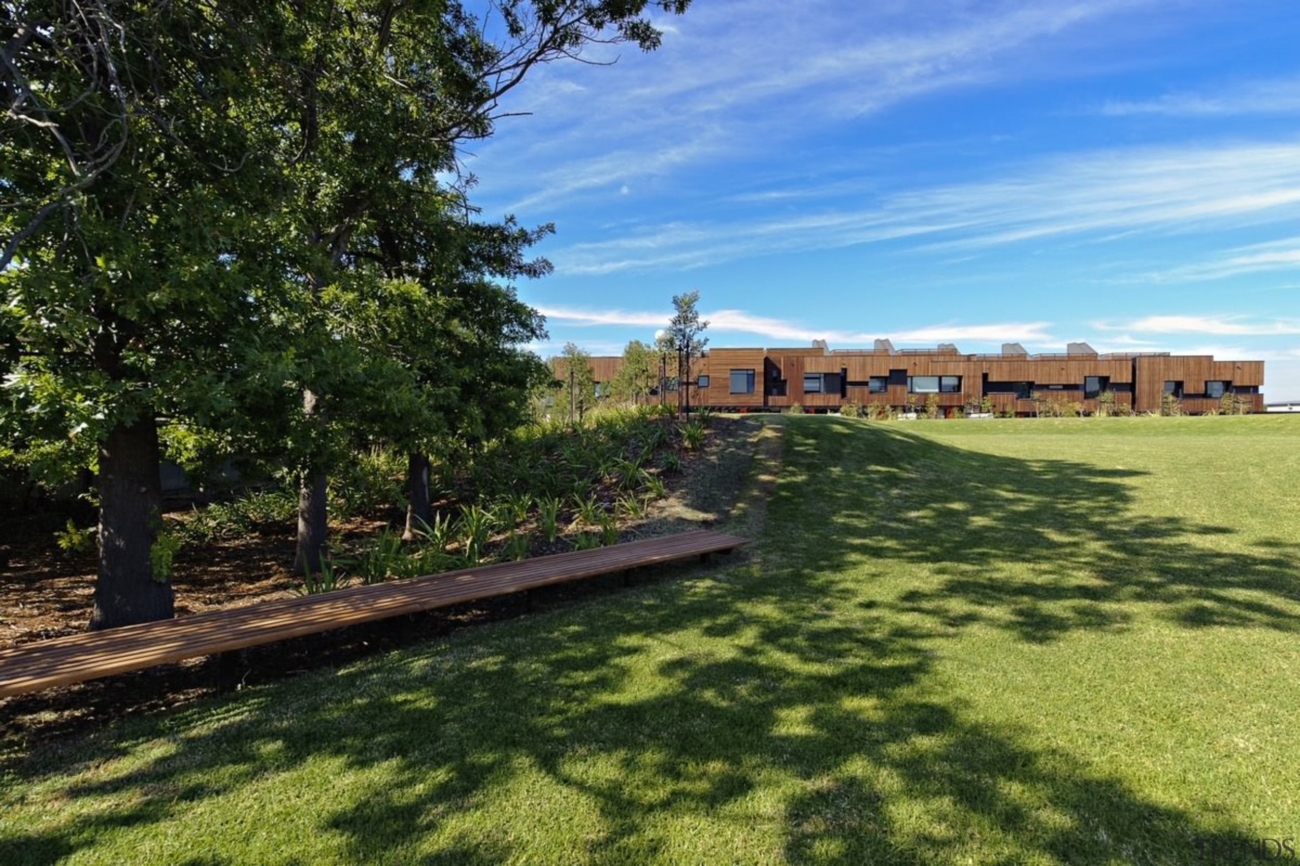 Shaded areas provide reprieve from the sun on area, cottage, estate, grass, home, house, land lot, landscape, lawn, property, real estate, sky, tree, yard, brown