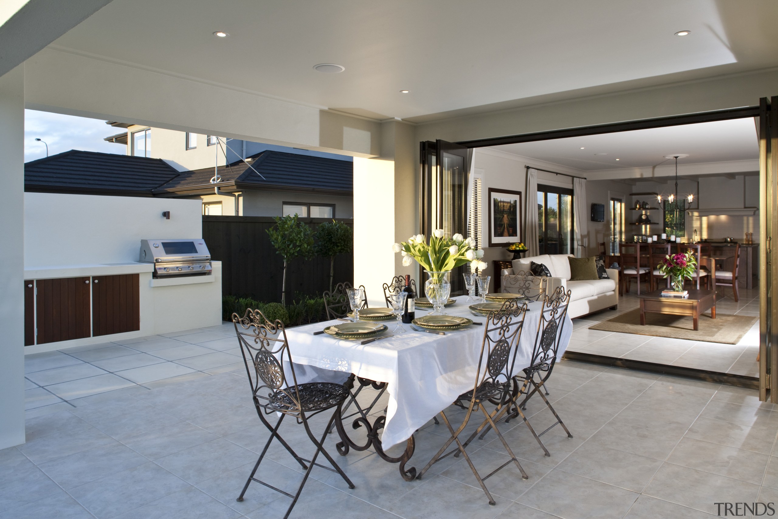 View of the covered patio area which features dining room, house, interior design, living room, property, real estate, table, gray