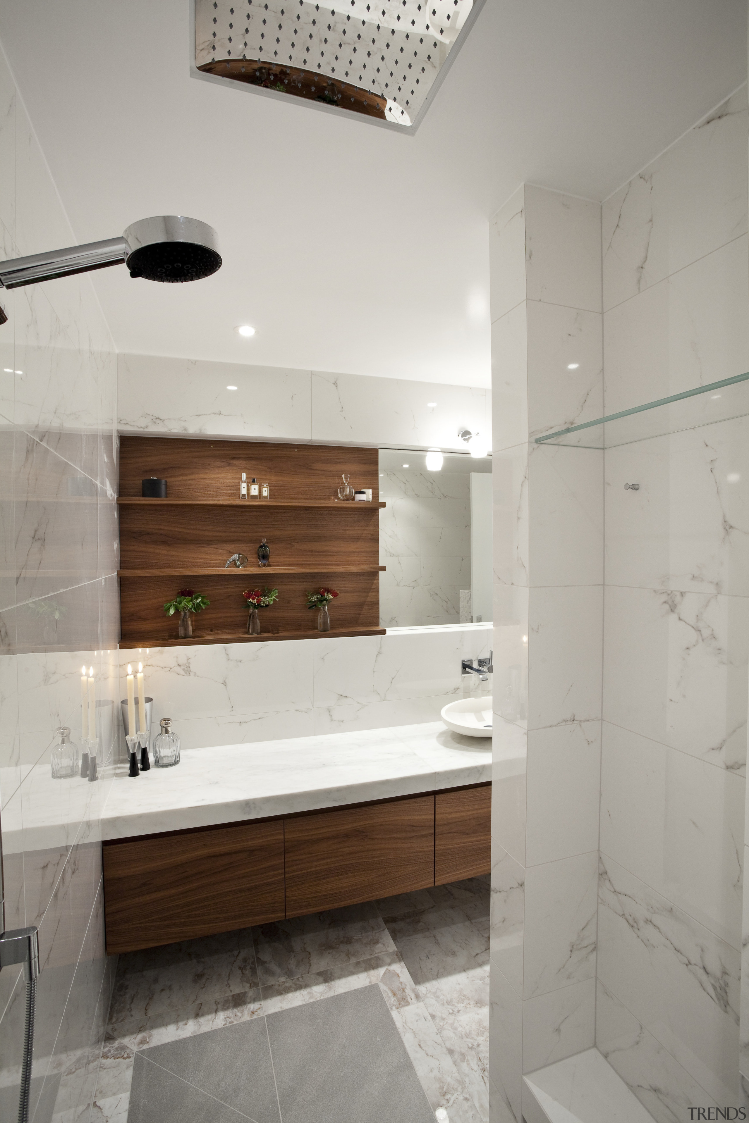 The shower in this bathroom incorporates a rainshower bathroom, floor, home, interior design, room, sink, tap, tile, gray