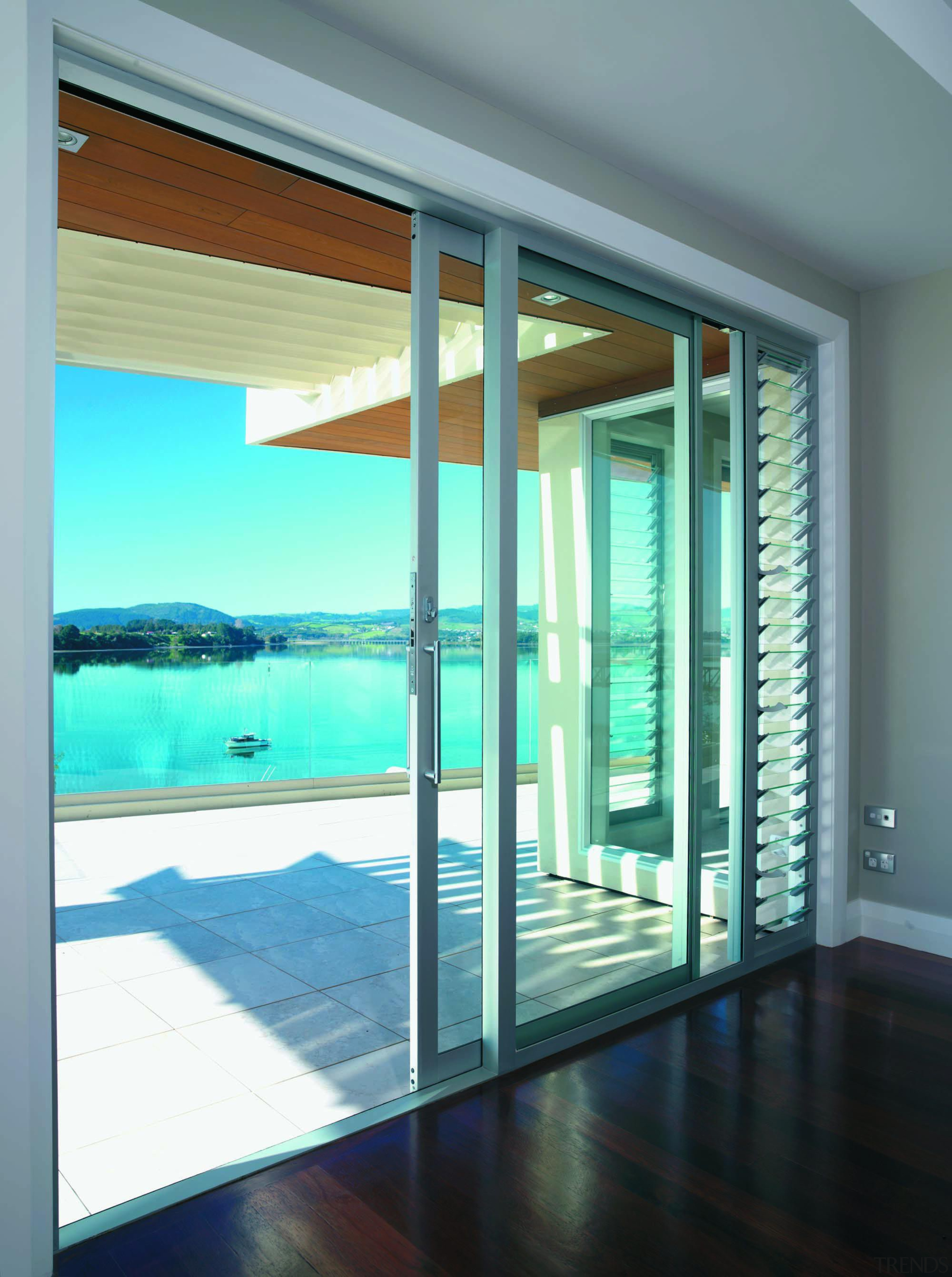 tauranga - condominium | daylighting | door | condominium, daylighting, door, glass, house, interior design, property, real estate, window, window covering, teal, gray