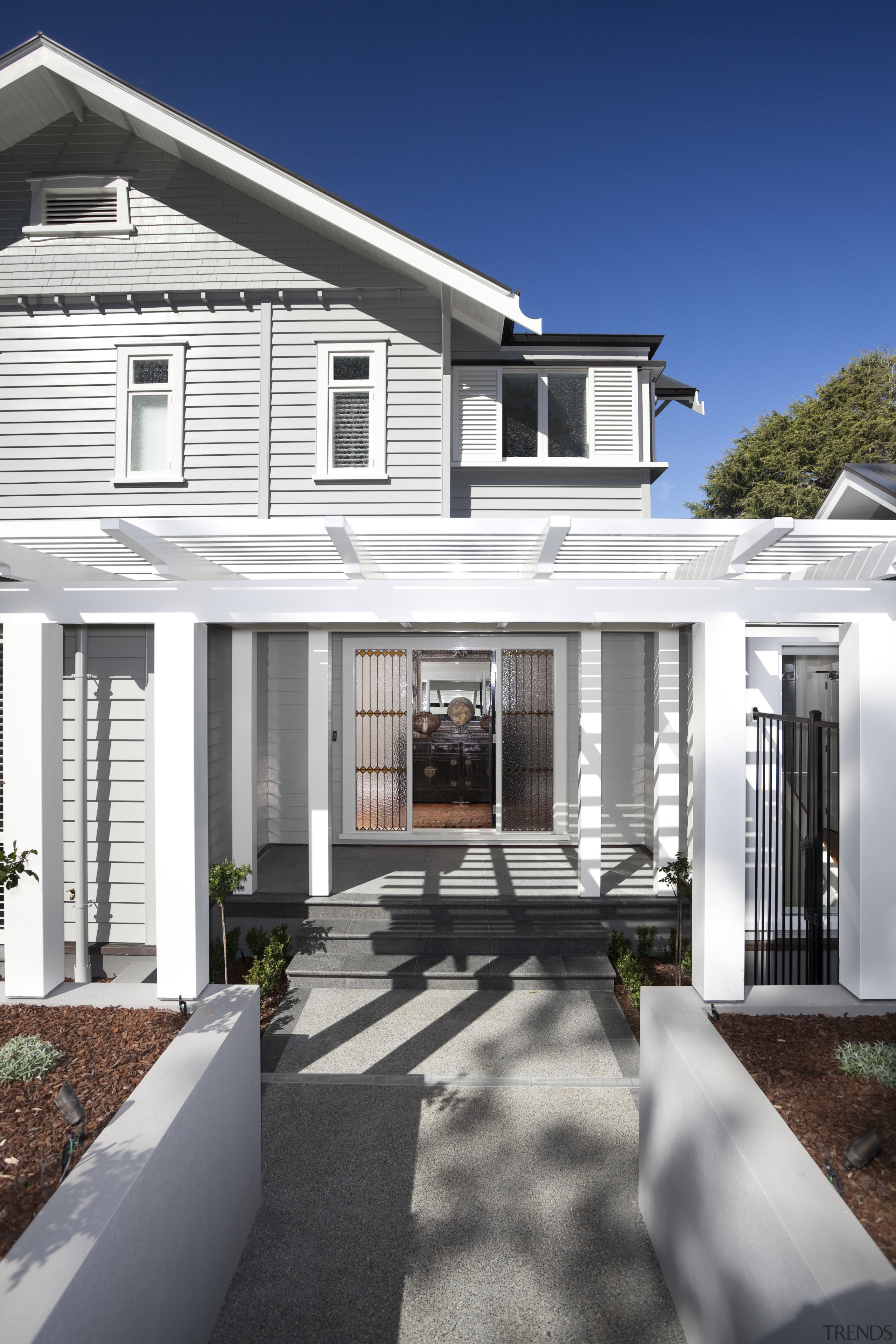 Architects Jane Aimer and Lindley Naismith of Scarlet architecture, backyard, building, cottage, elevation, estate, facade, farmhouse, home, house, porch, property, real estate, residential area, siding, suburb, window, white