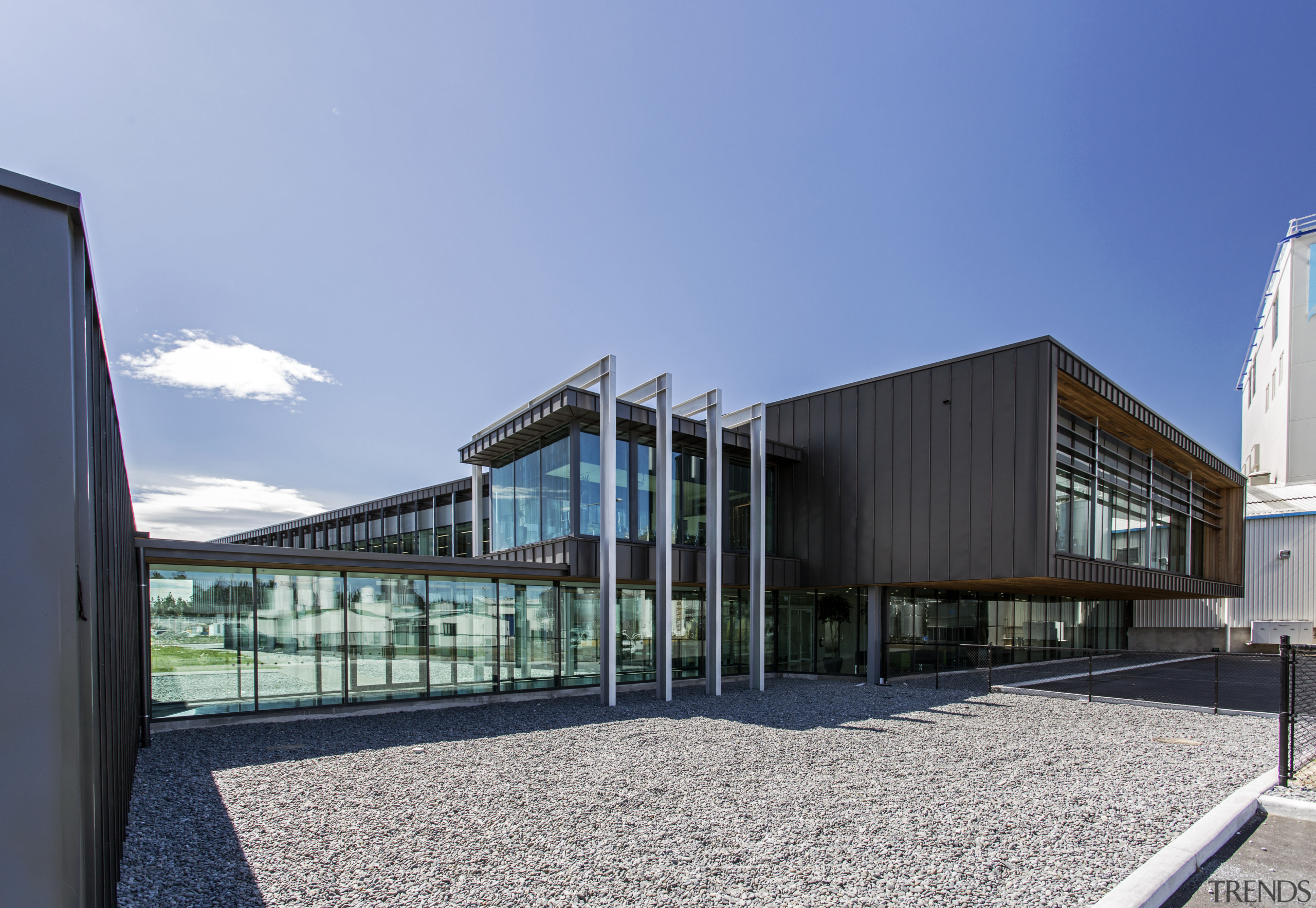 The simple cantilevered, steel-clad forms shaping the new architecture, building, corporate headquarters, facade, house, mixed use, teal