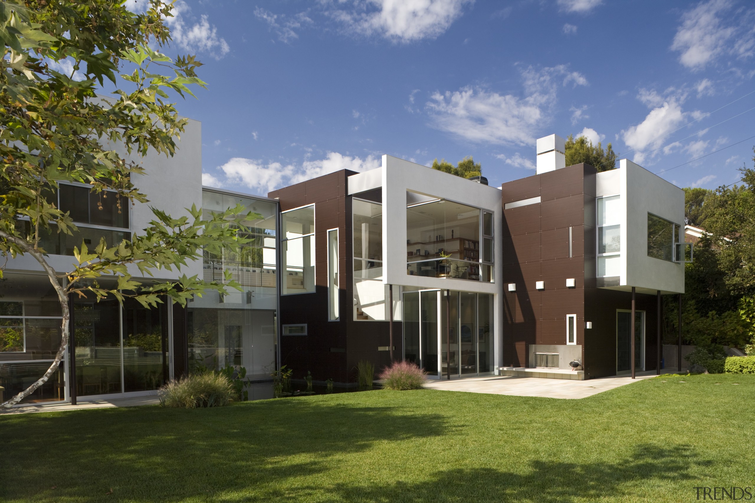 Exterior view of house which features cladding, roofing, apartment, architecture, cottage, elevation, estate, facade, home, house, mixed use, neighbourhood, property, real estate, residential area, brown