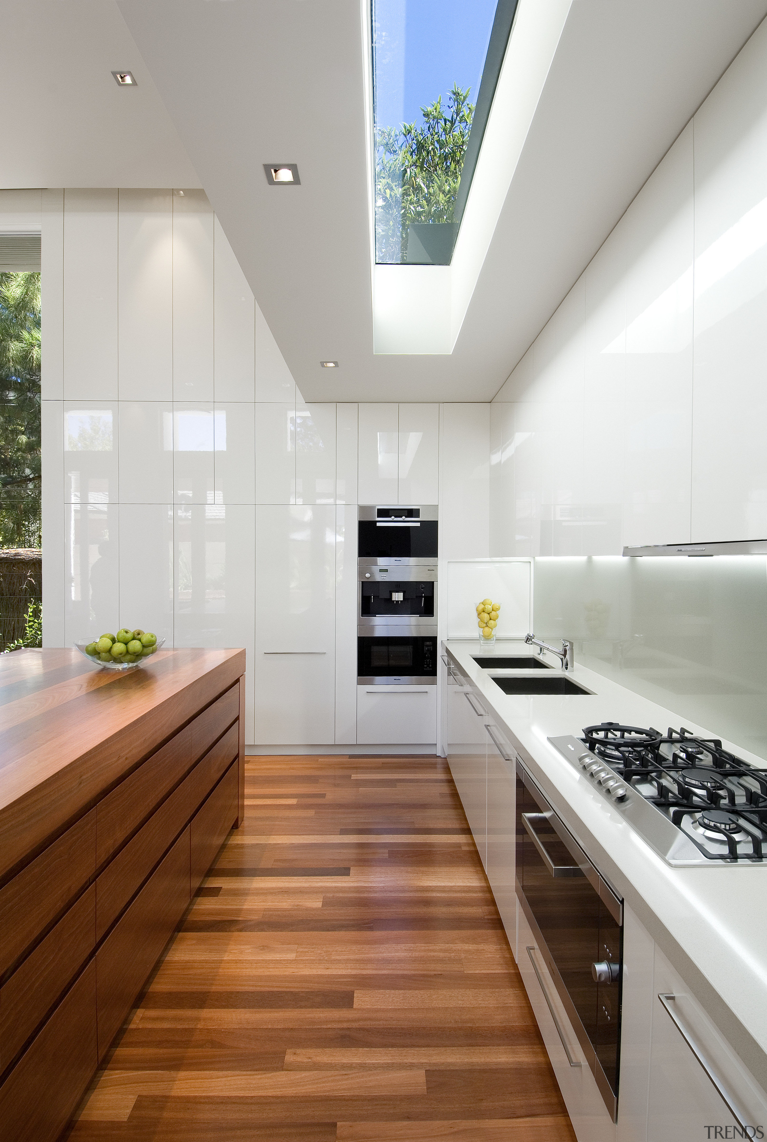 A view of this kitchen featuring the latest architecture, countertop, daylighting, floor, house, interior design, kitchen, gray, white