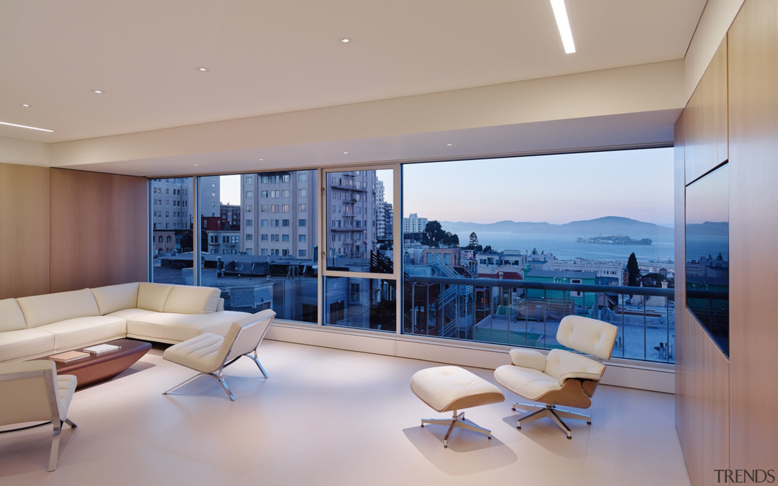 Looking out to Alcatraz in the evening - apartment, architecture, ceiling, condominium, daylighting, estate, floor, home, house, interior design, living room, penthouse apartment, property, real estate, window, gray