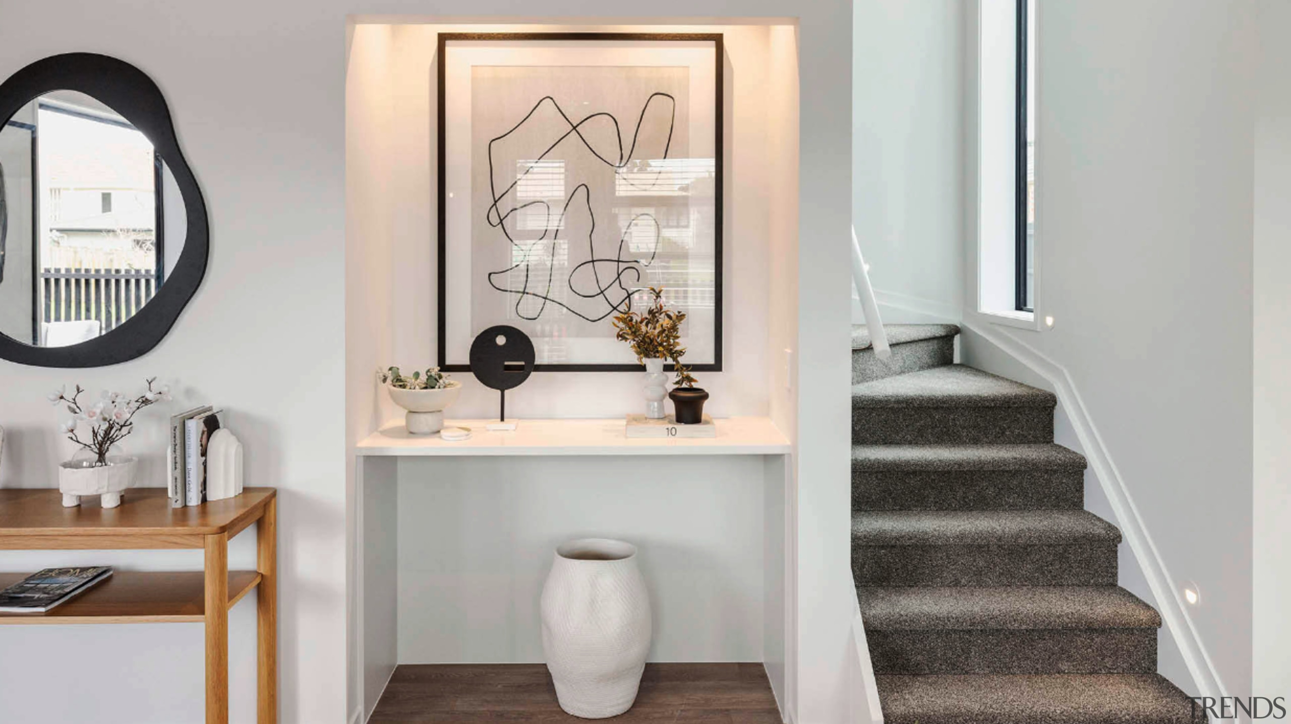 Display nook and carpeted stairs to the private 