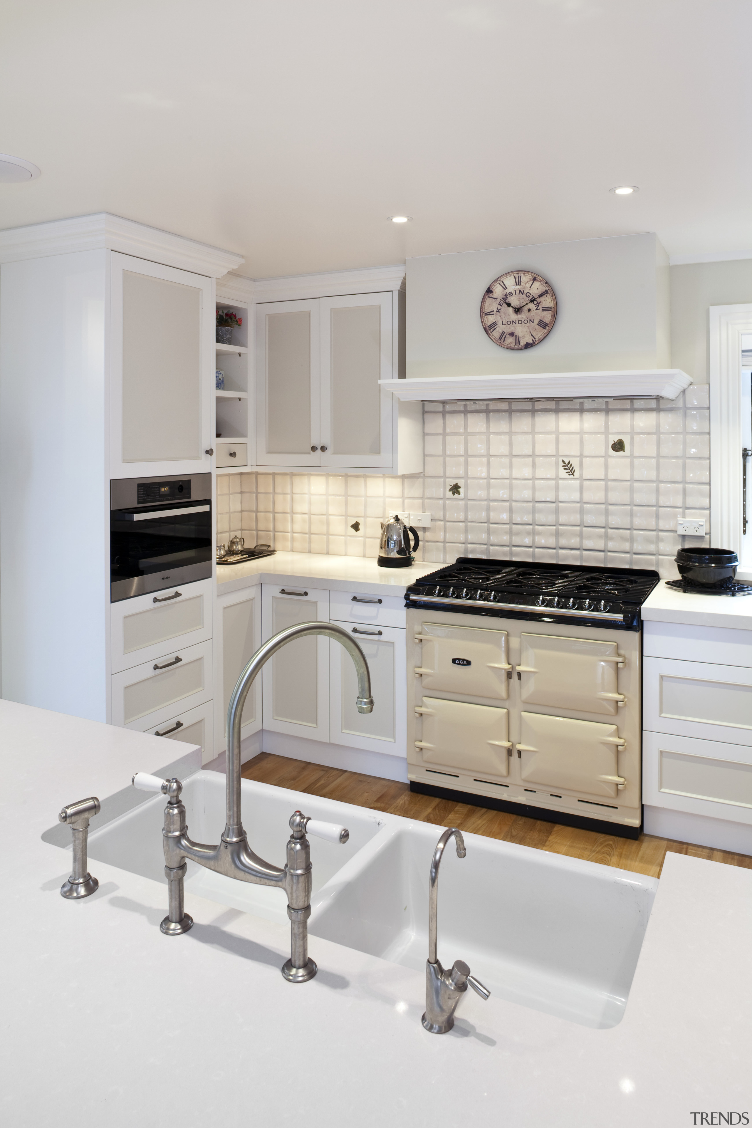 View of a traditional-styled kitchen which features a cabinetry, countertop, cuisine classique, home appliance, interior design, kitchen, kitchen stove, room, gray