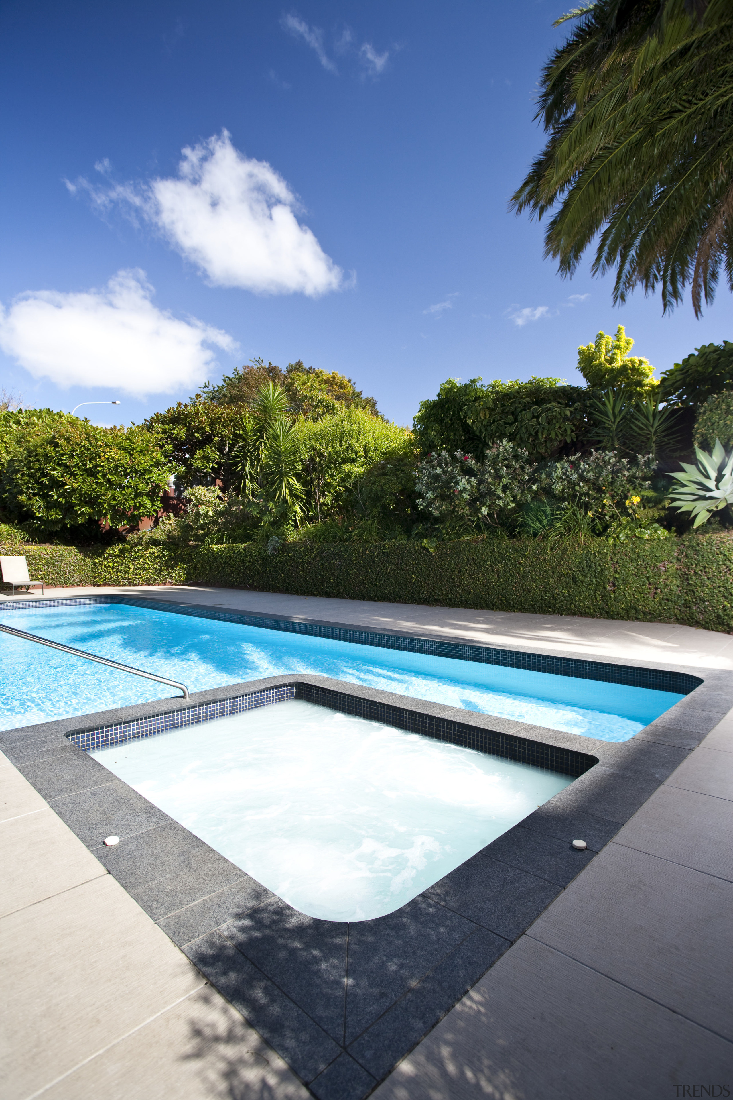 Exterior view of an outdoor area which features cloud, estate, house, leisure, plant, property, real estate, reflection, resort, sky, swimming pool, tree, vacation, water