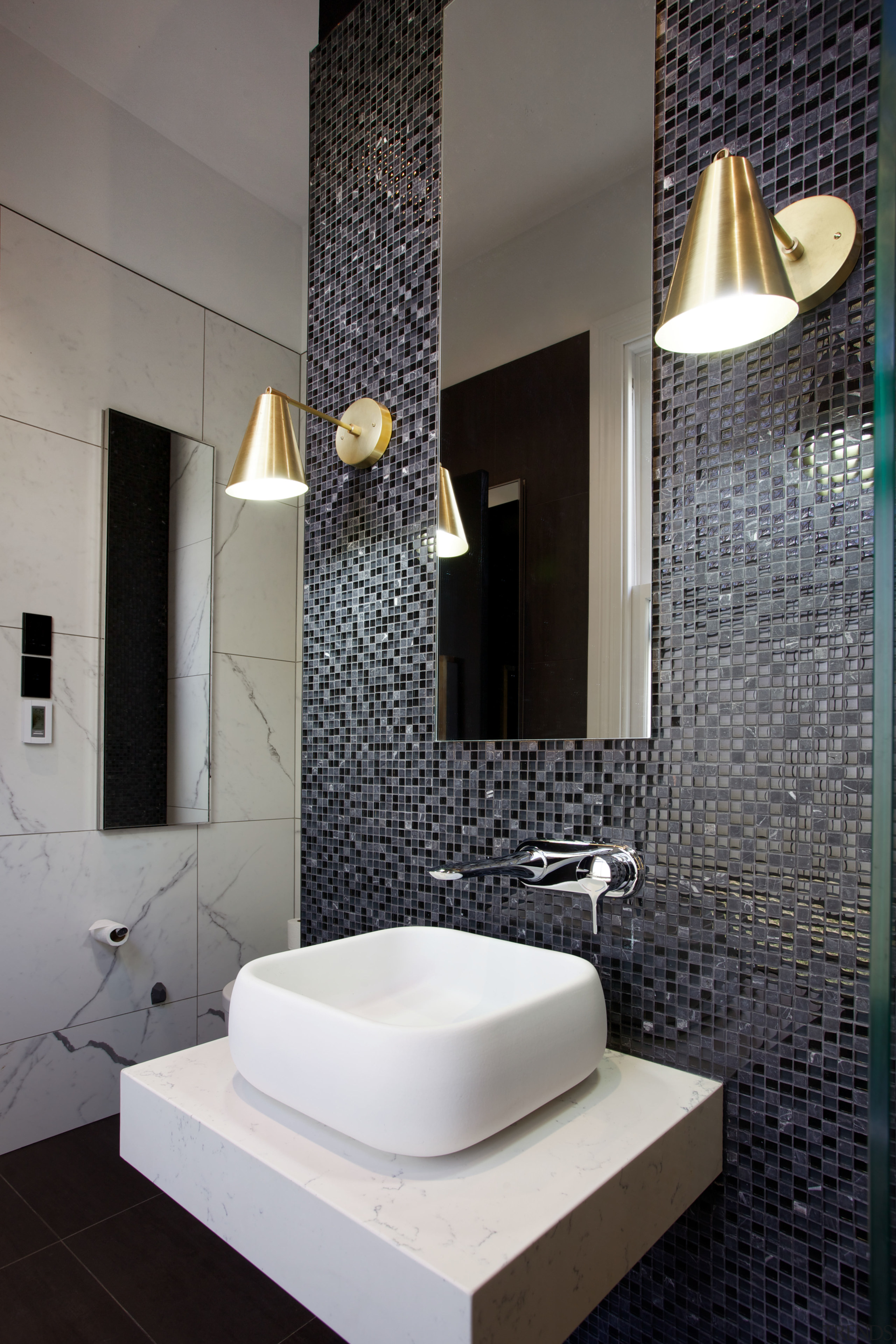 Mosaic tiles wrap around chimney breast that had architecture, bathroom, ceramic, floor, flooring, interior design, plumbing fixture, product design, room, sink, tile, wall, gray, black