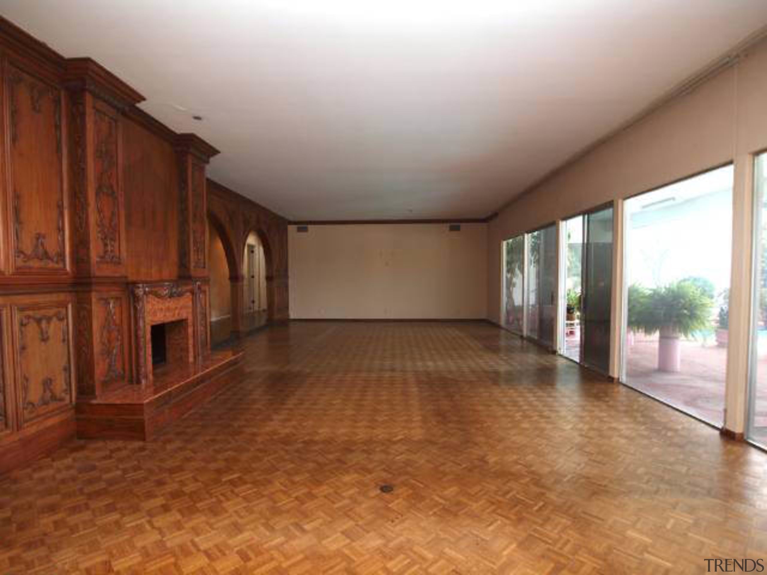 Wood panelling and a parquet floor were features ceiling, estate, floor, flooring, hardwood, home, house, laminate flooring, property, real estate, room, wood, wood flooring, wood stain, brown, gray