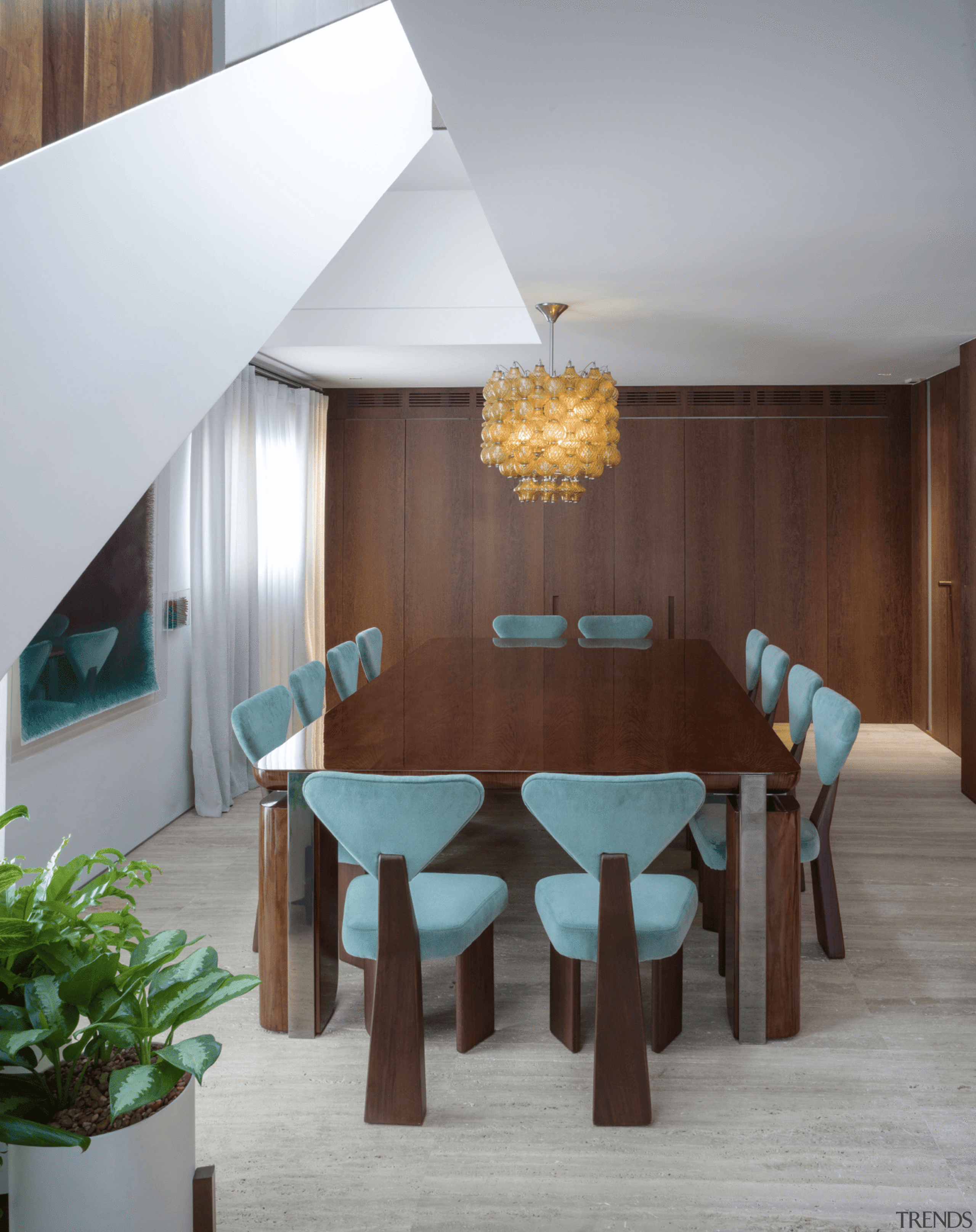 Dining area with partitioned off kitchen behind. 