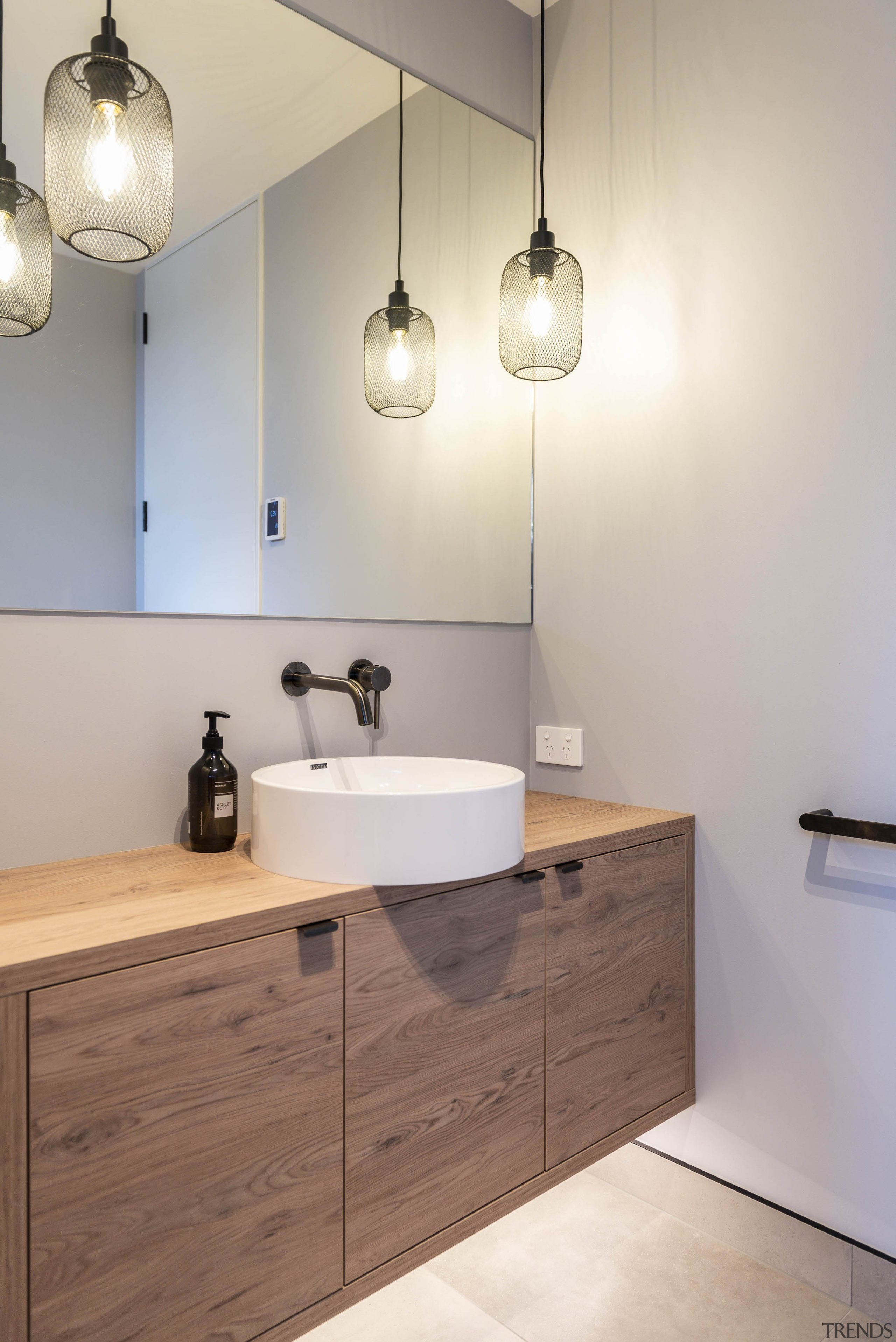 A wood vanity adds a natural aesthetic in 