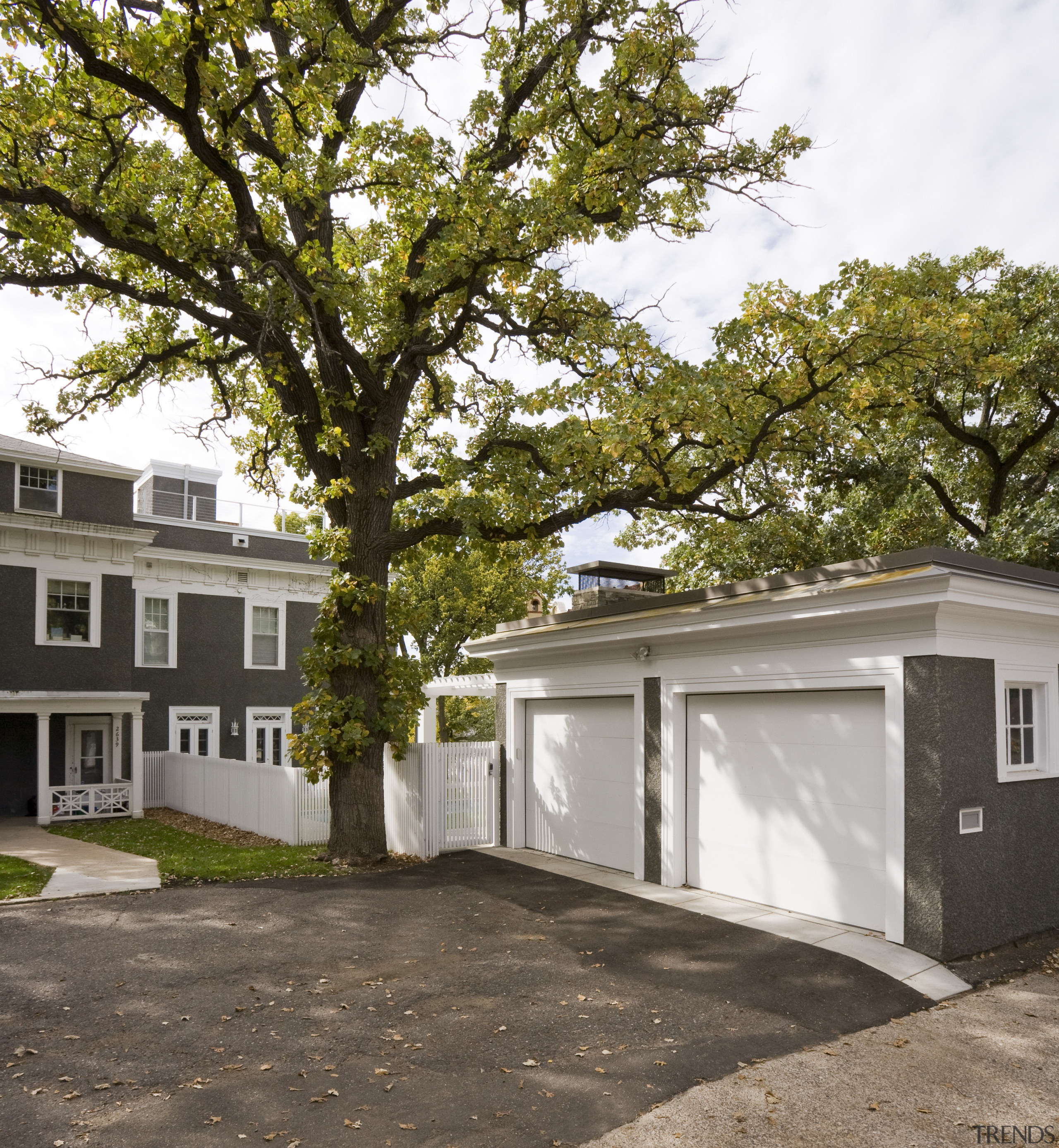 View of a multi-storey grey house with swimming architecture, building, cottage, facade, home, house, neighbourhood, plant, property, real estate, residential area, tree, brown, gray