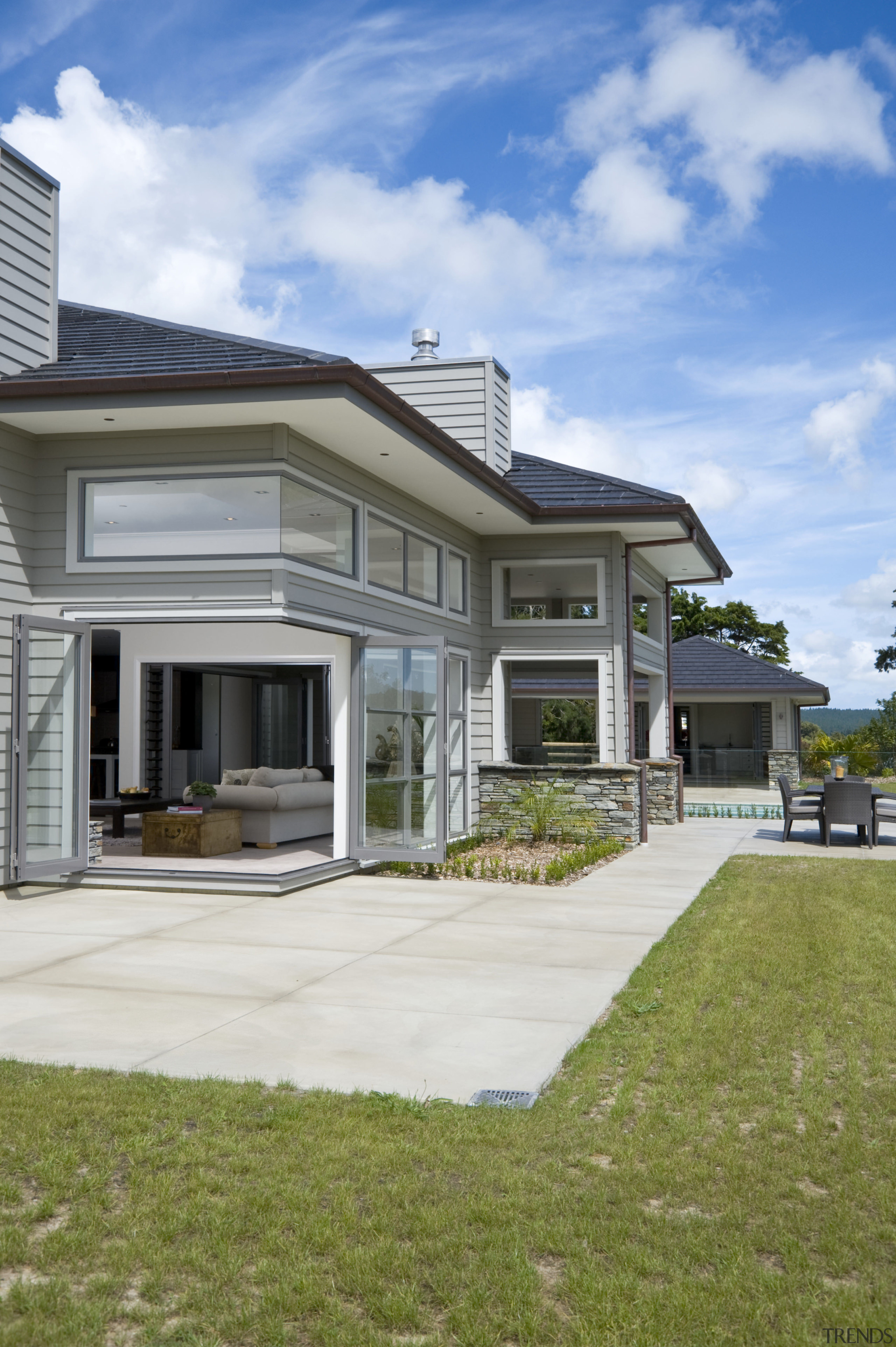 Image of this family home which creates a cottage, elevation, estate, facade, farmhouse, home, house, property, real estate, residential area, siding, sky, suburb, villa, window, yard