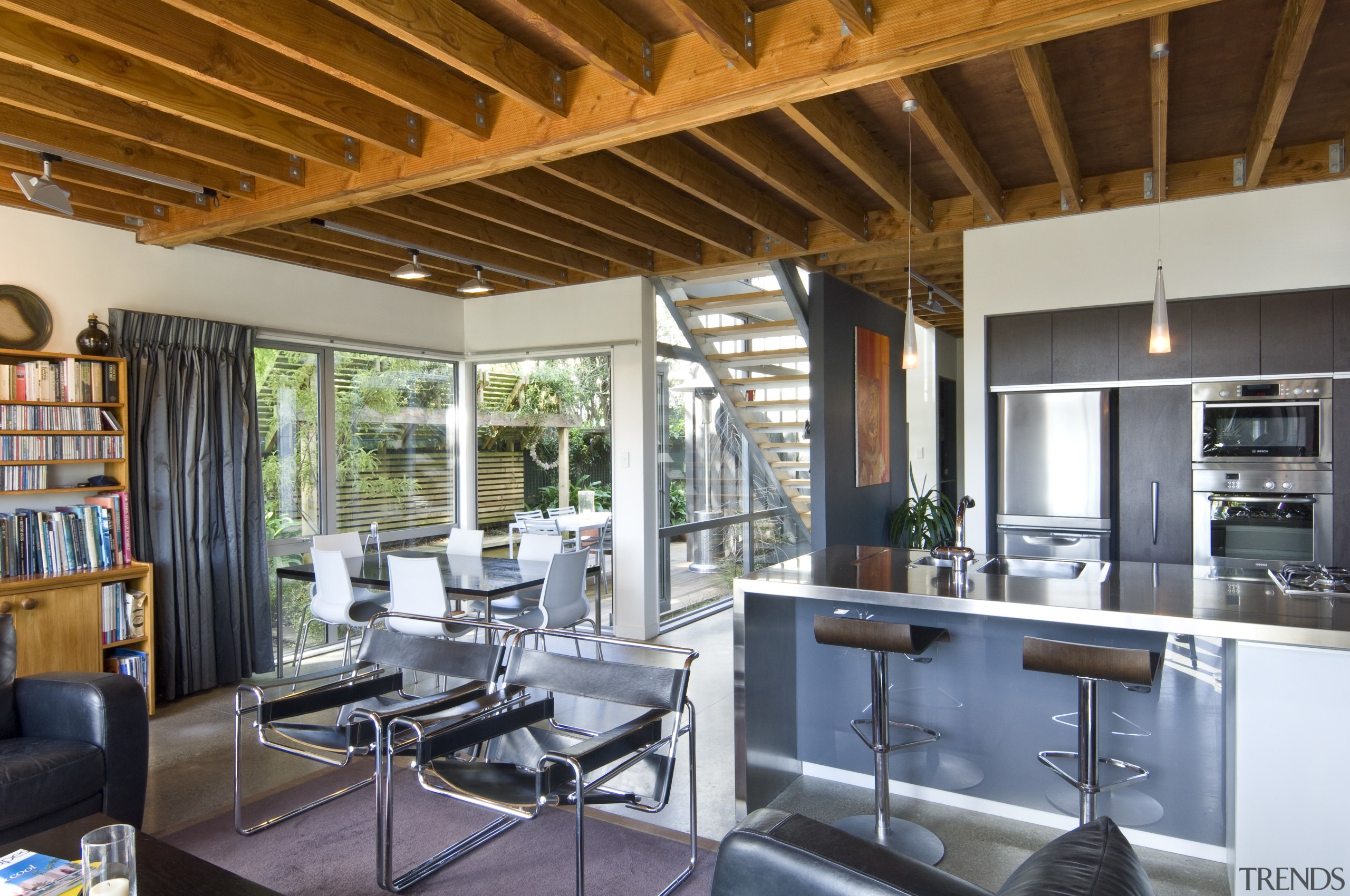 This home features a stairway wall that is interior design, real estate, brown, gray