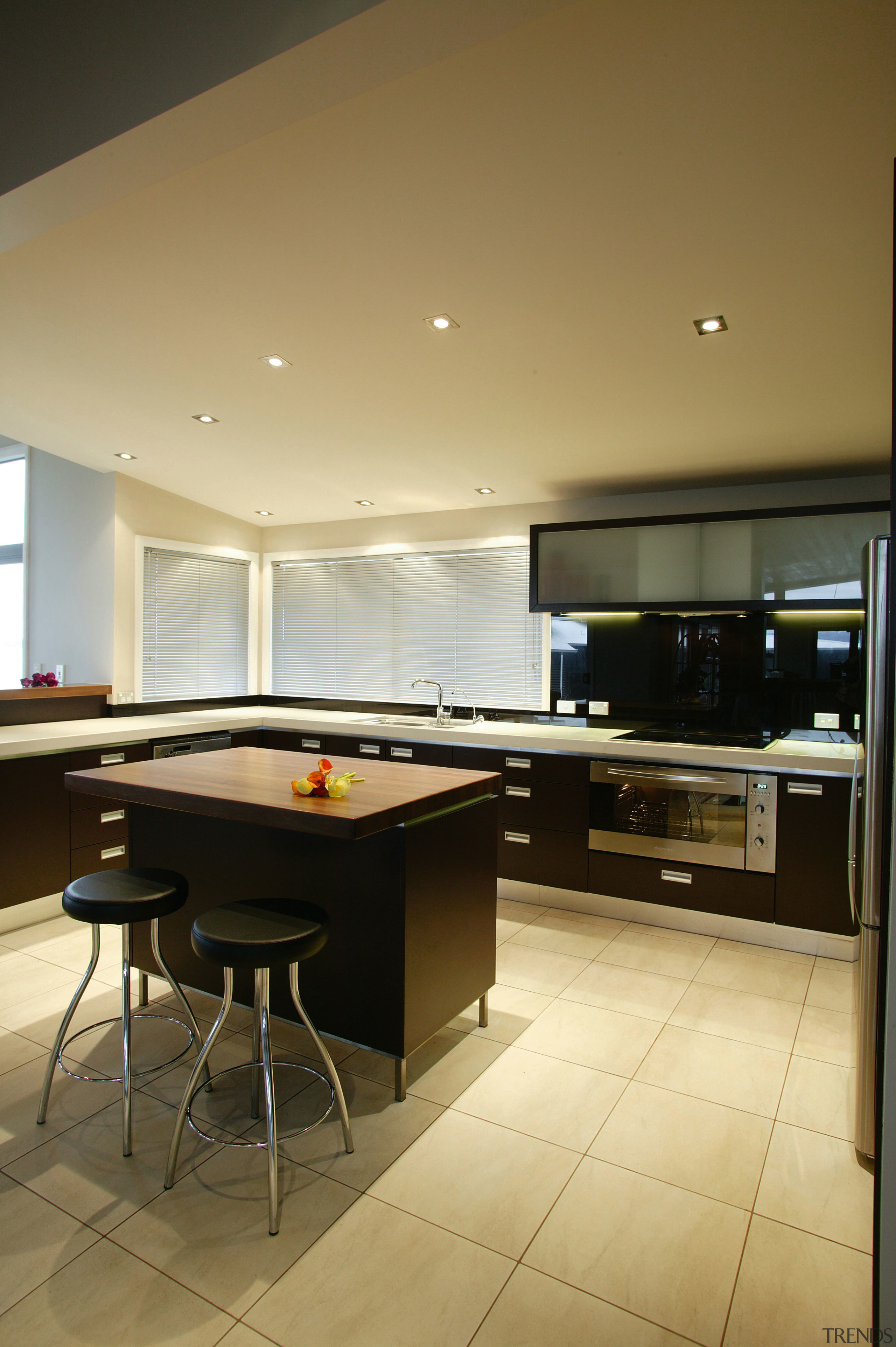 Kitchen with brown cabinetry and white benchtop with billiard room, ceiling, countertop, floor, flooring, interior design, kitchen, recreation room, room, table, brown