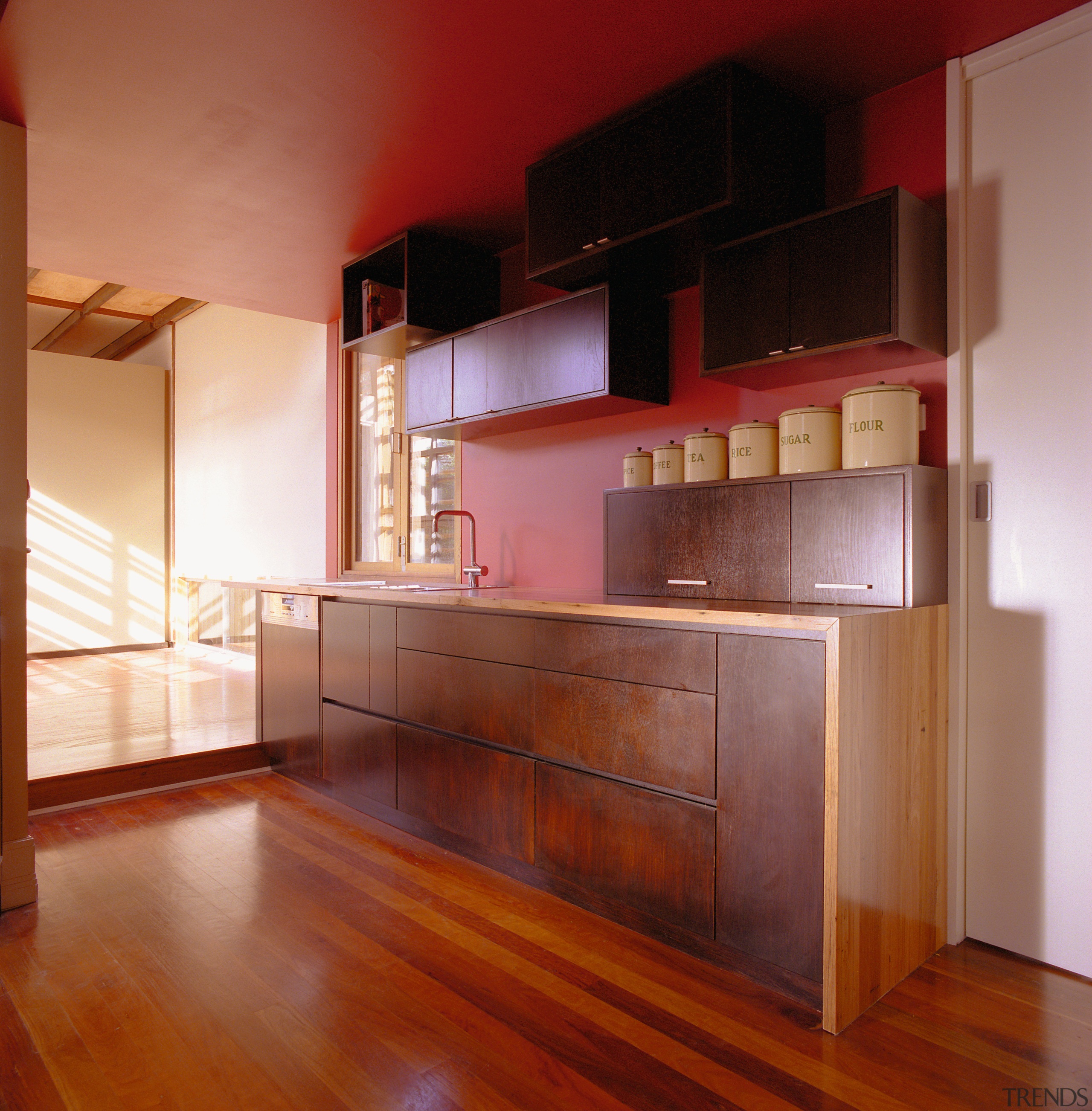 A view of the kitchen area, wooden flooring, cabinetry, countertop, cuisine classique, floor, flooring, furniture, hardwood, interior design, kitchen, laminate flooring, room, shelf, wood, wood flooring, wood stain, brown, red