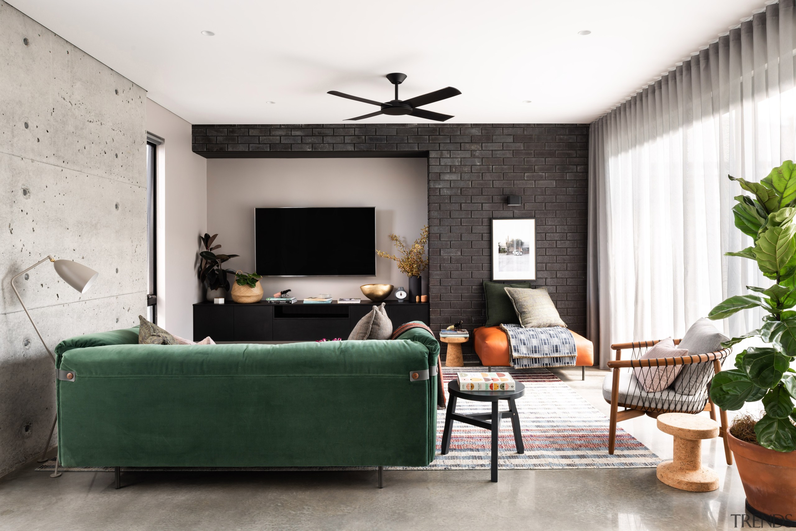 ​​​​​​​A feature cast-in-situ concrete wall with all imperfections architecture, coffee table, comfort, couch, design, floor, flooring, furniture, green, home, house, interior design, living room, passive heating, concrete wall, polished concrete floor, Dalecki Design