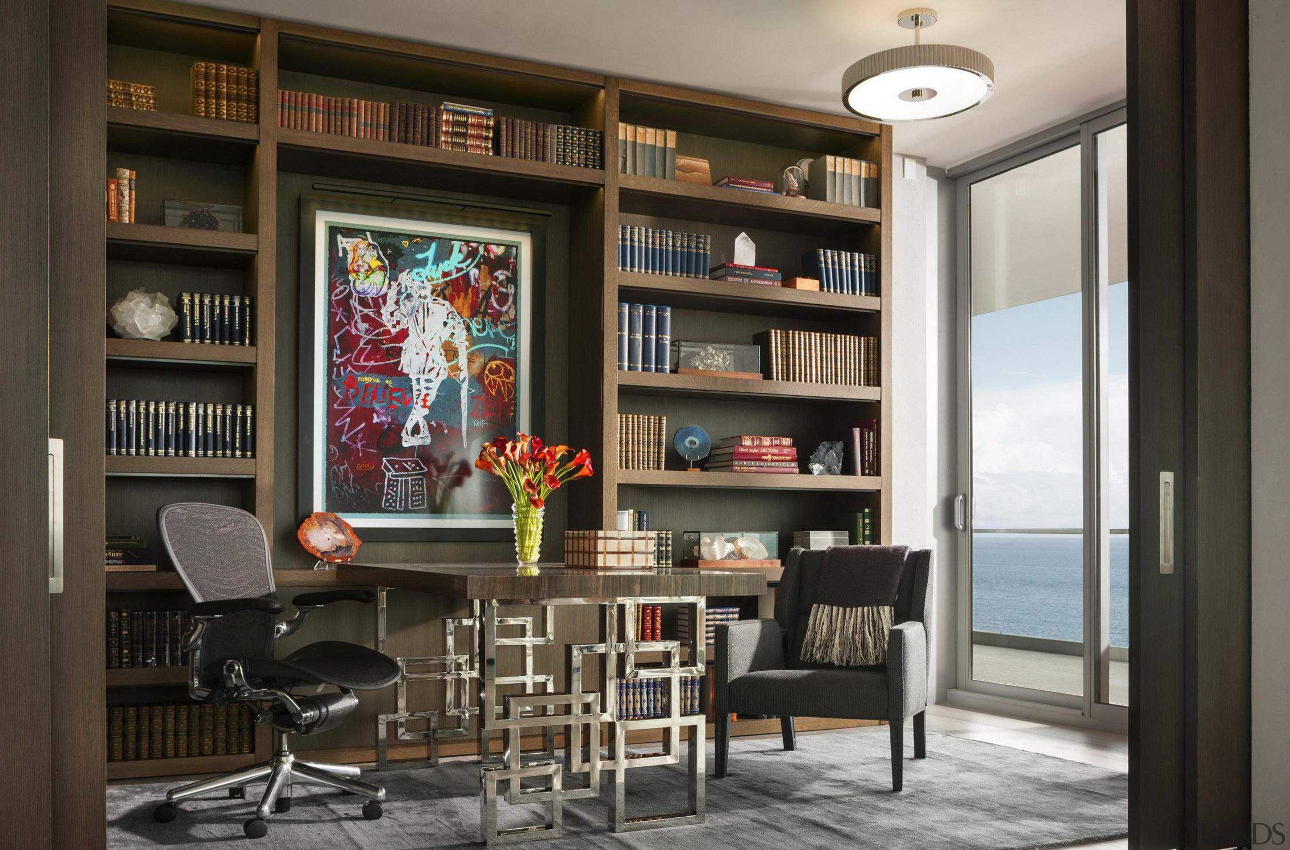 The library/study with its subtle Asian references has architecture, bookcase, building, ceiling, furniture, home, house, interior design, living room, room, shelf, shelving, table, wall, black, gray