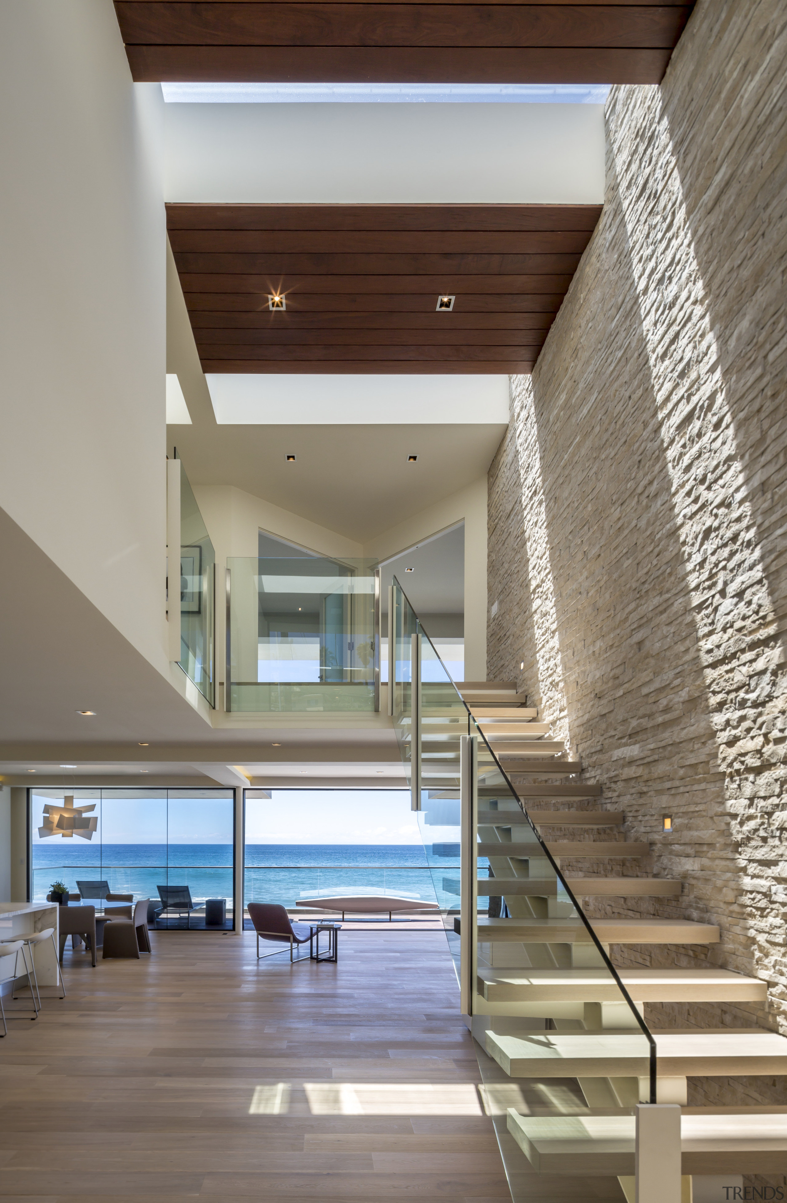 Three large skylights above the entranceway of this apartment, architecture, ceiling, condominium, daylighting, estate, floor, handrail, hardwood, house, interior design, lobby, real estate, stairs, wood, gray