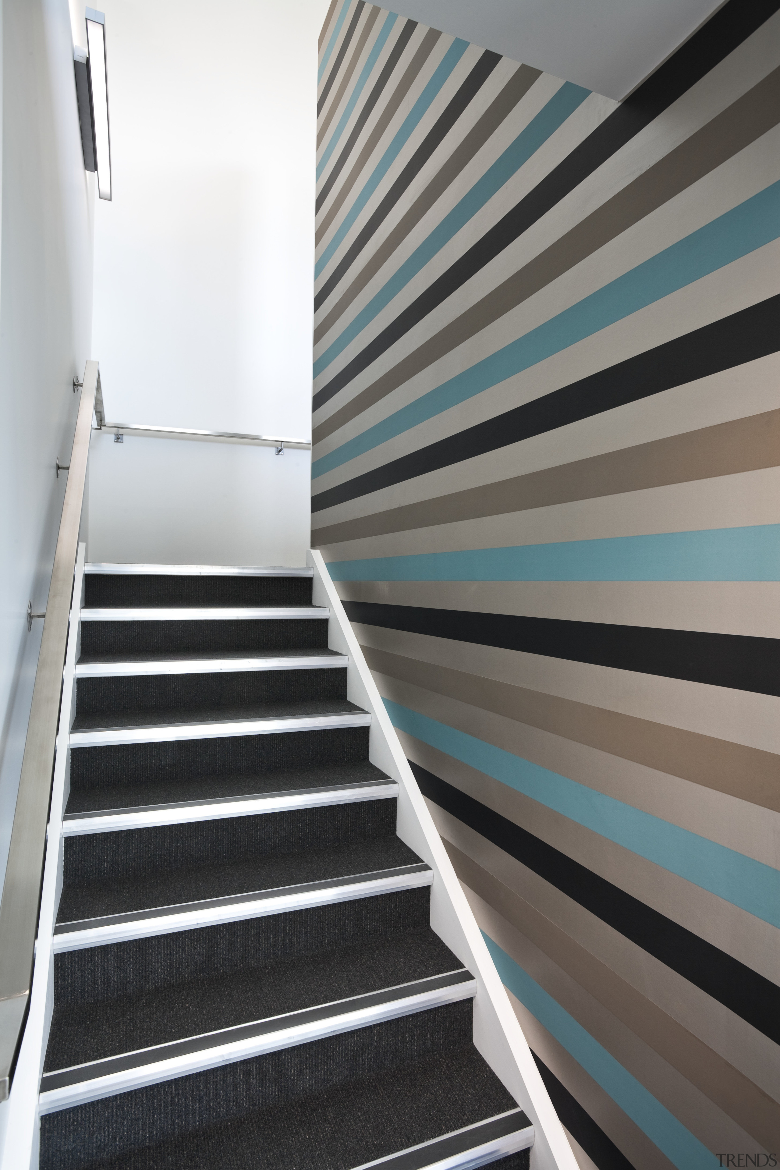 The office interiors at the Club Tower reflect angle, architecture, daylighting, floor, handrail, house, line, stairs, wall, gray, white, black