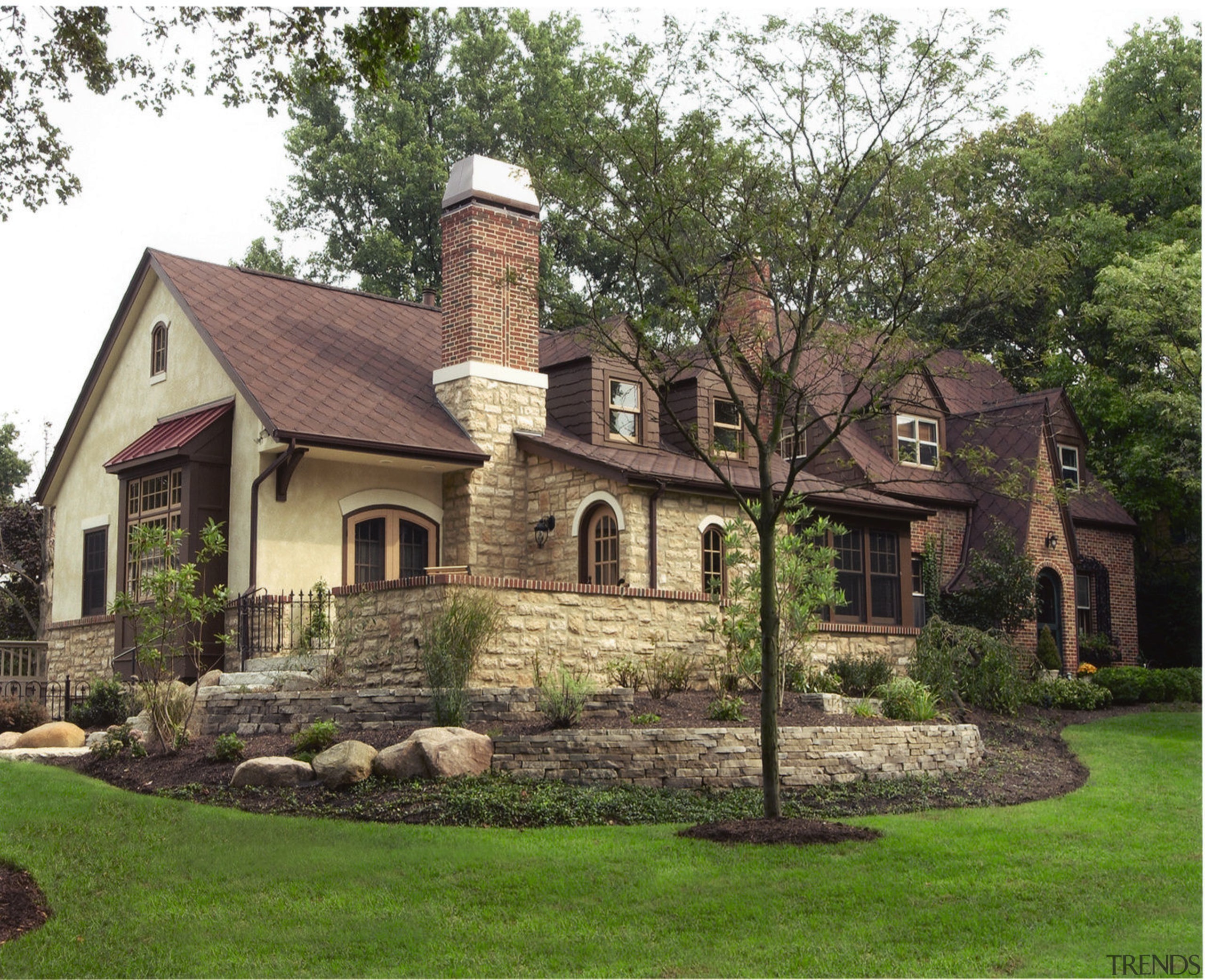 Exterior view of a home, large lawn, rock cottage, estate, farmhouse, historic house, home, house, landscape, landscaping, mansion, outdoor structure, property, real estate, roof, tree, yard, brown