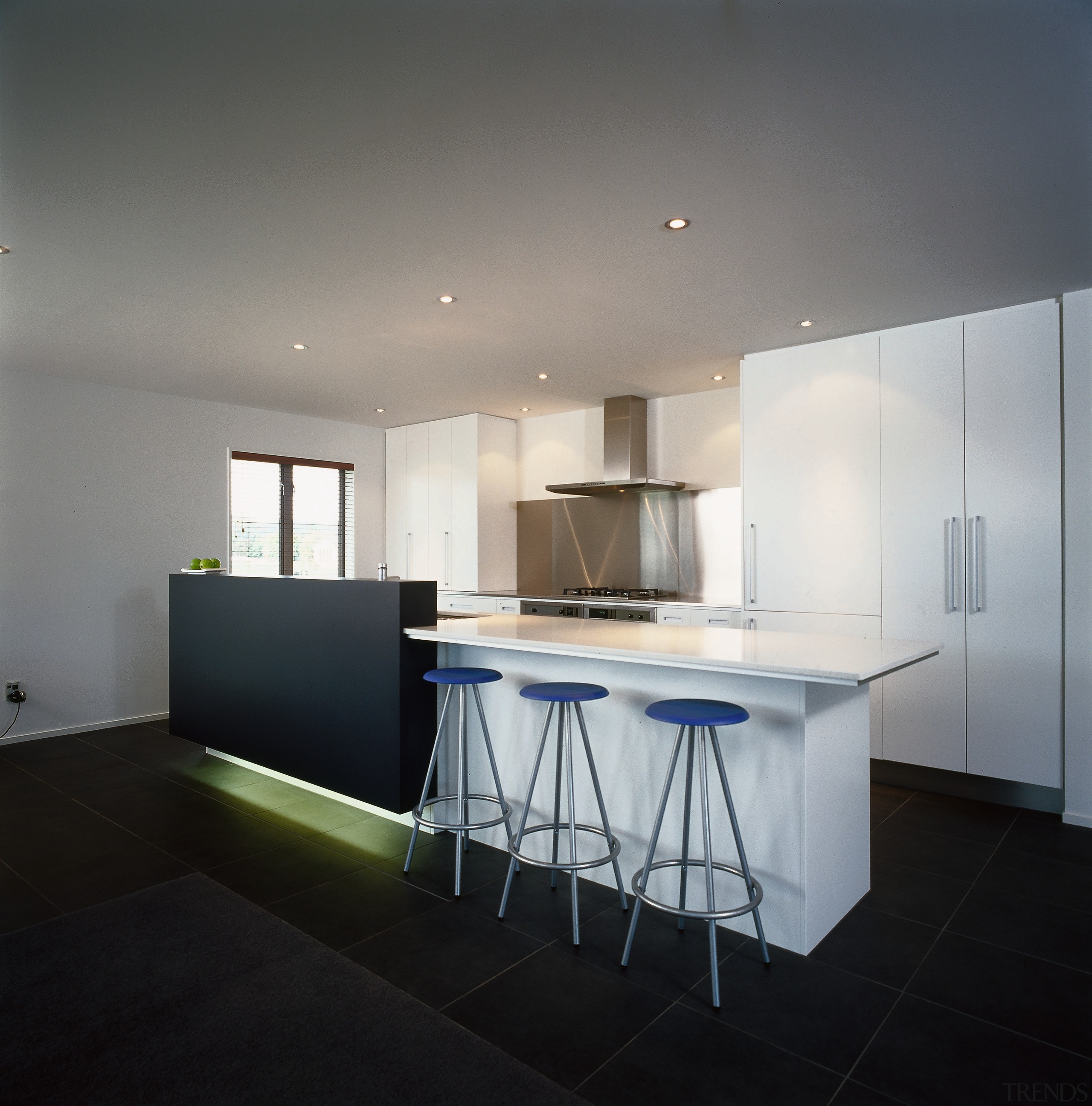 Kitchen with white cabinetry, floor to ceiling storage, architecture, ceiling, countertop, daylighting, floor, house, interior design, kitchen, product design, real estate, room, table, gray, black