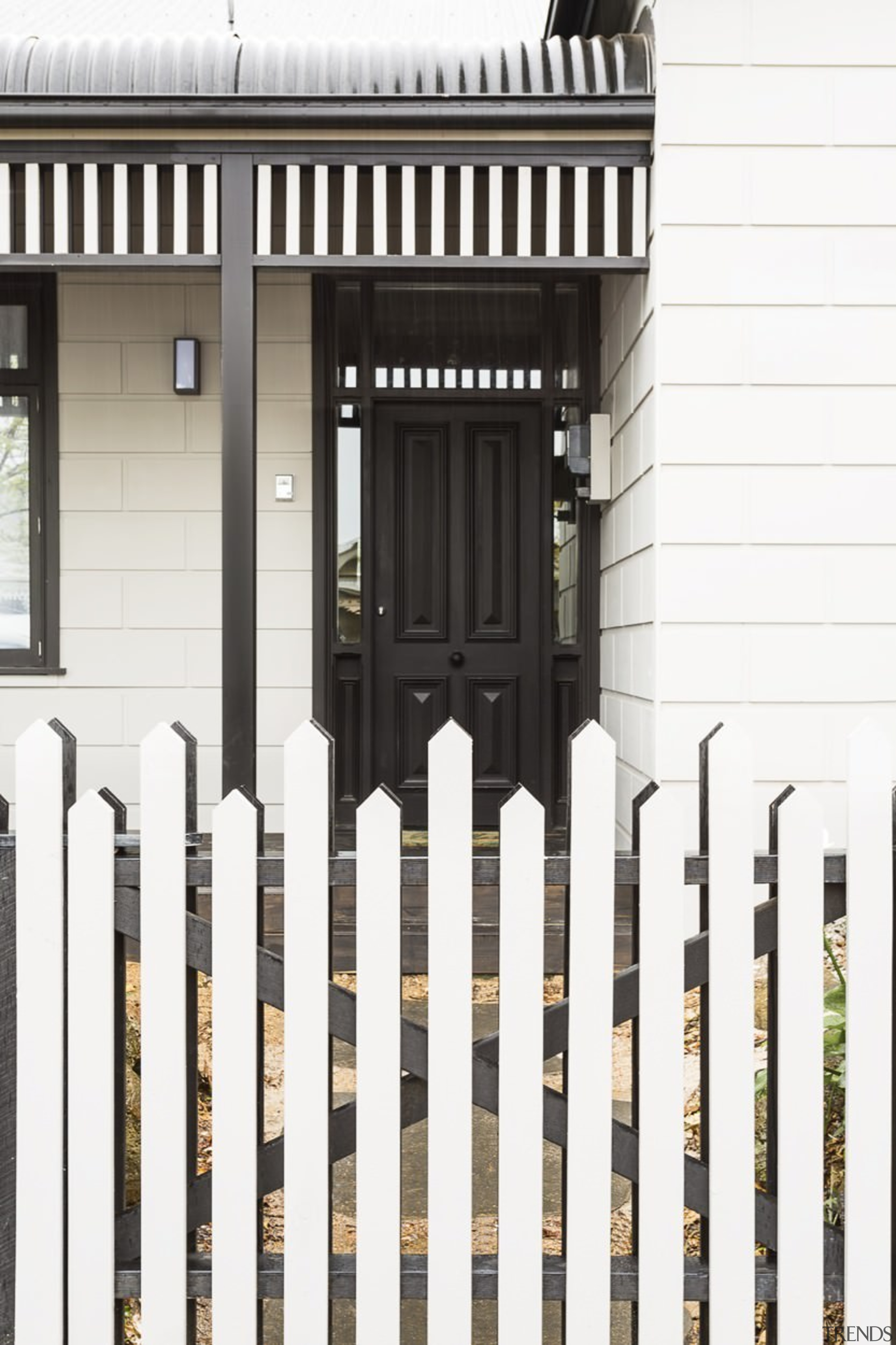 A new take on the picket fence invites facade, fence, gate, home fencing, iron, outdoor structure, picket fence, siding, structure, white