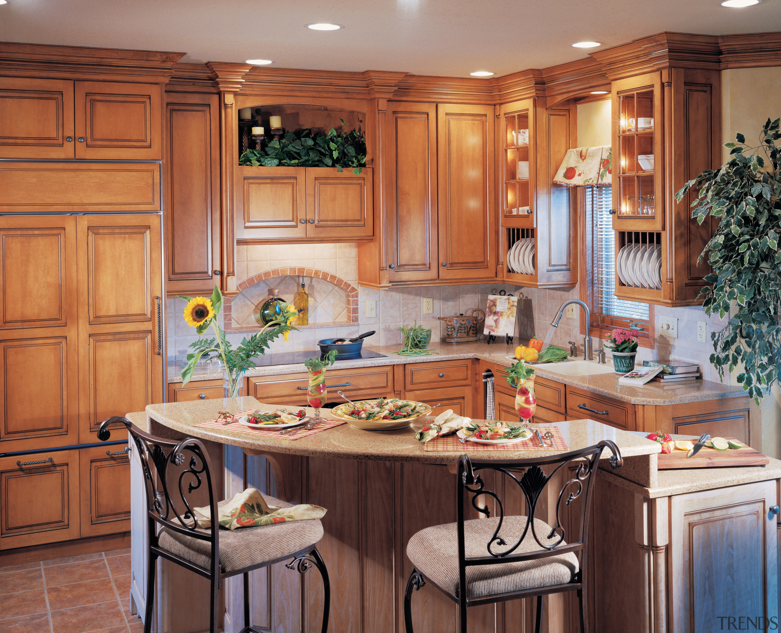 Kitchen with wood cabinetry, curved stone island with cabinetry, countertop, cuisine classique, interior design, kitchen, room, red, orange