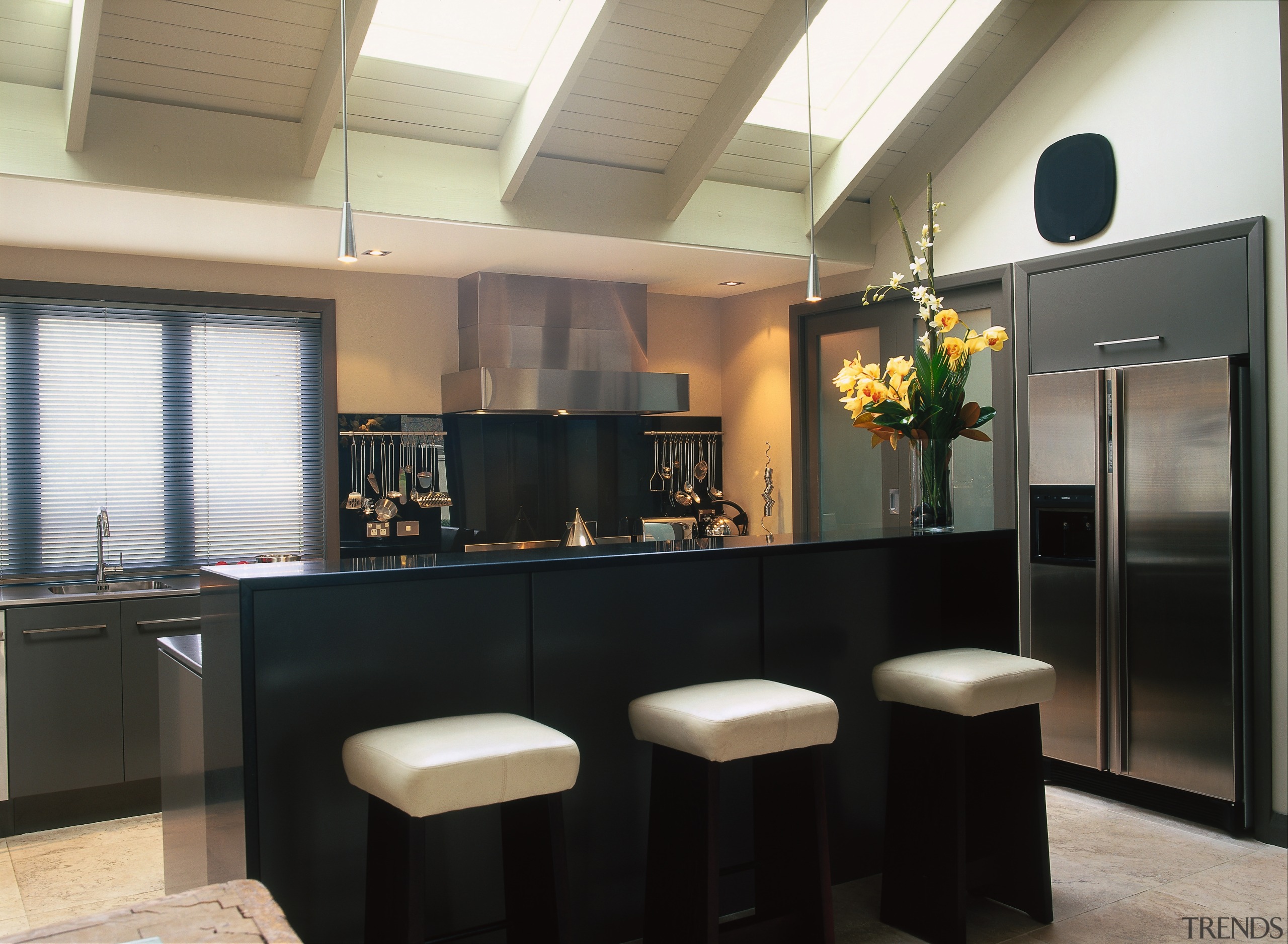 The view of a kitchen with a central countertop, interior design, kitchen, real estate, black