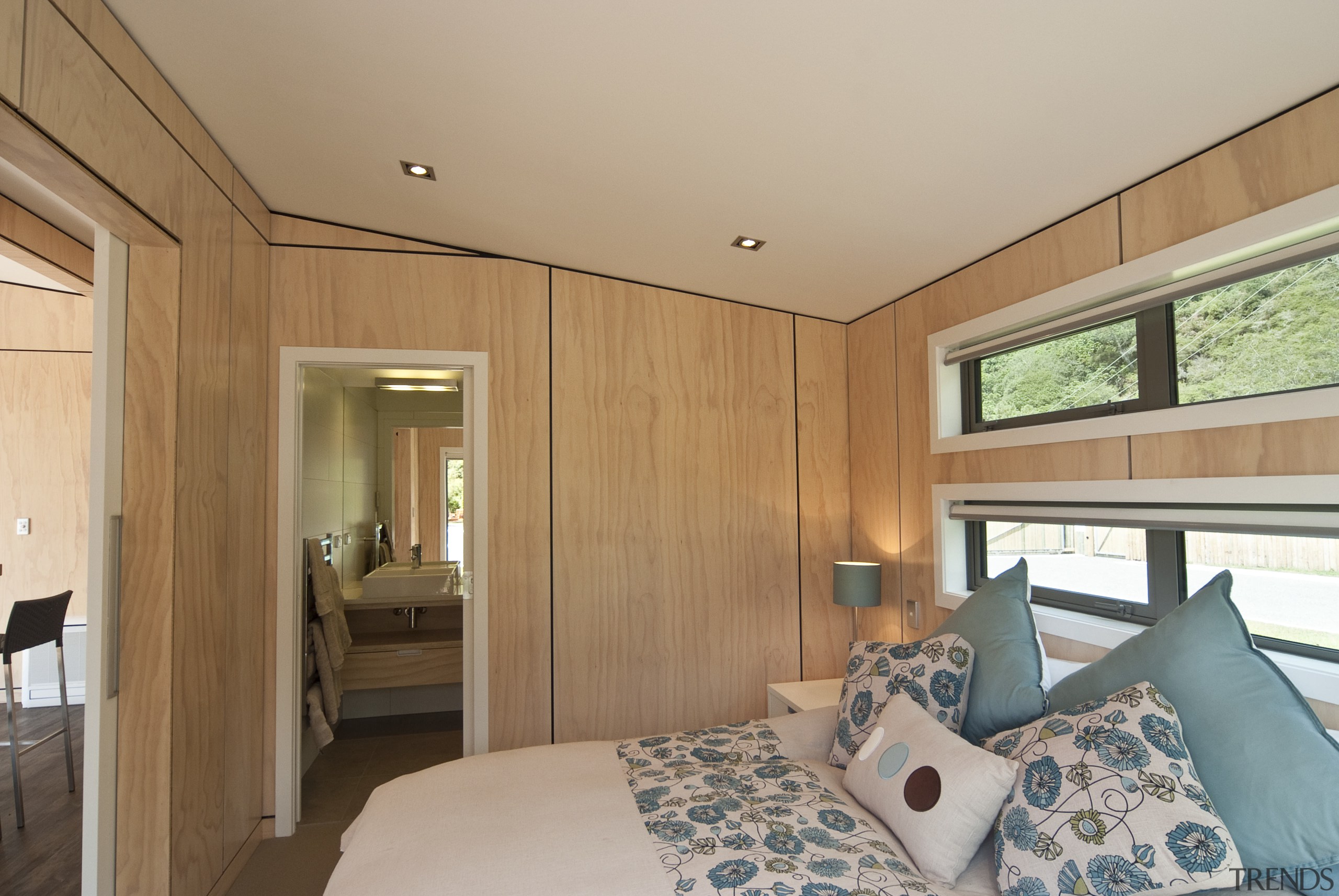 Interior view of the bedroom features panelling and bedroom, ceiling, estate, home, house, interior design, property, real estate, room, window, wood, orange, gray, brown