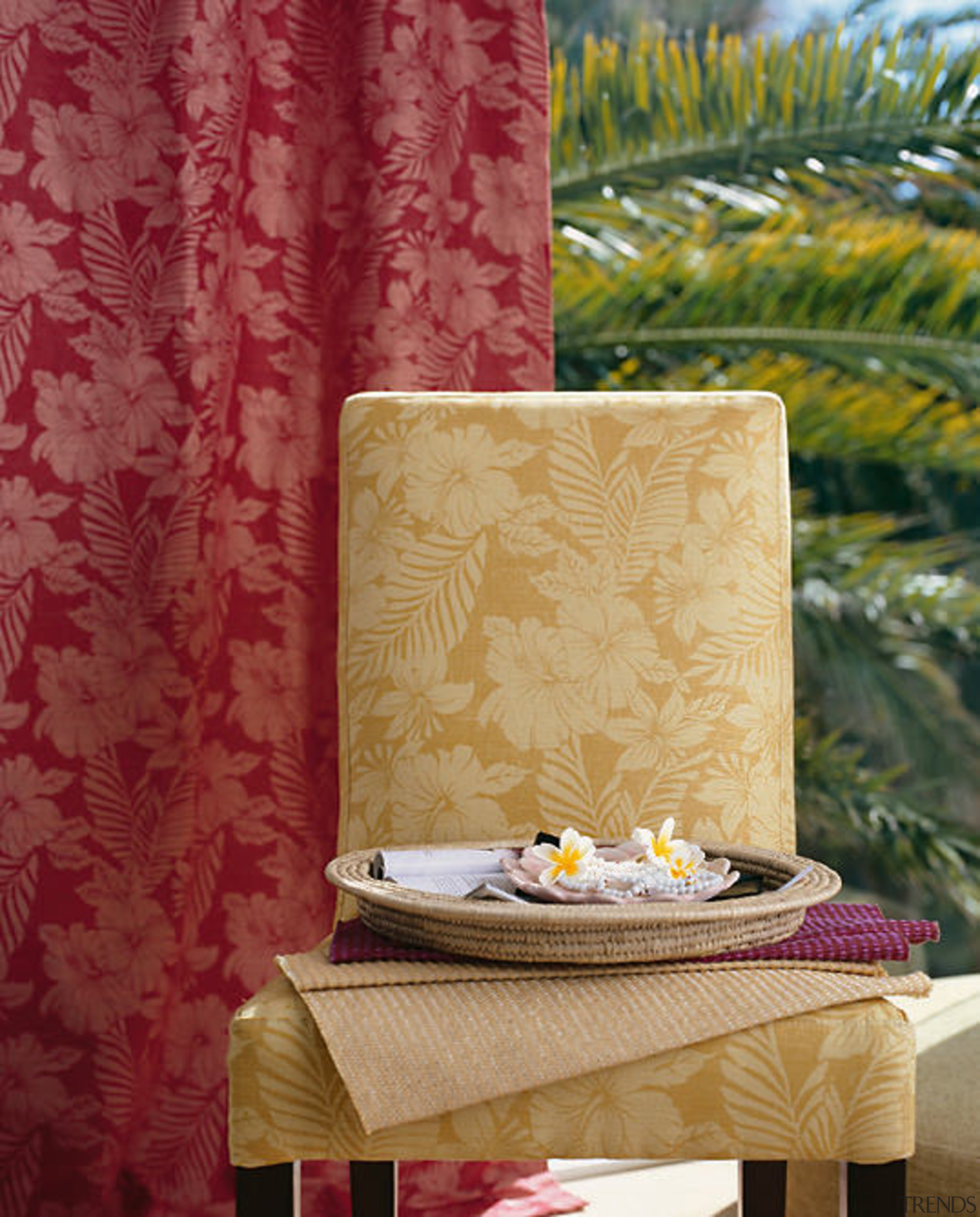 A view of the cushion and furniture with curtain, interior design, tablecloth, textile, wall, wallpaper, red