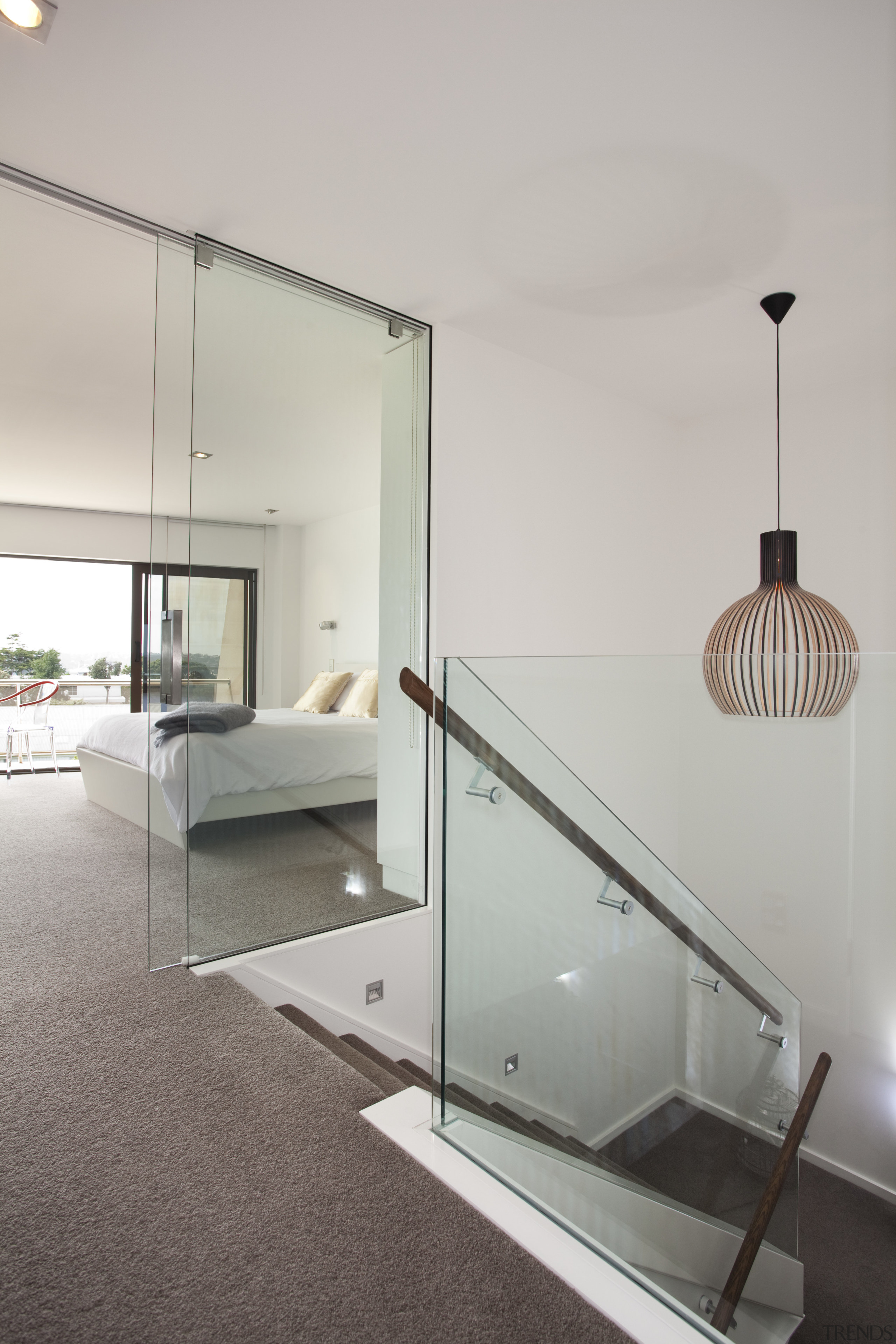 Glass balustrading and floor-to-ceiling glazed doors give a architecture, ceiling, daylighting, floor, glass, handrail, home, house, interior design, product design, table, gray