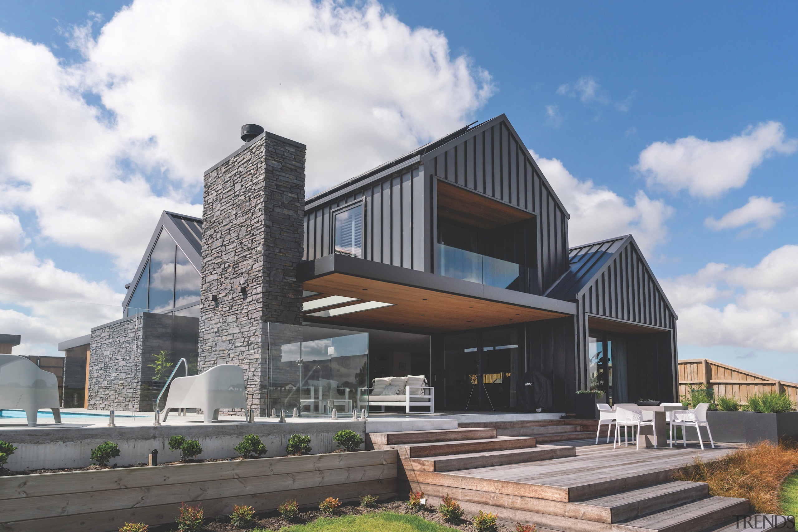 Locally sourced timbers and natural stone soften the 