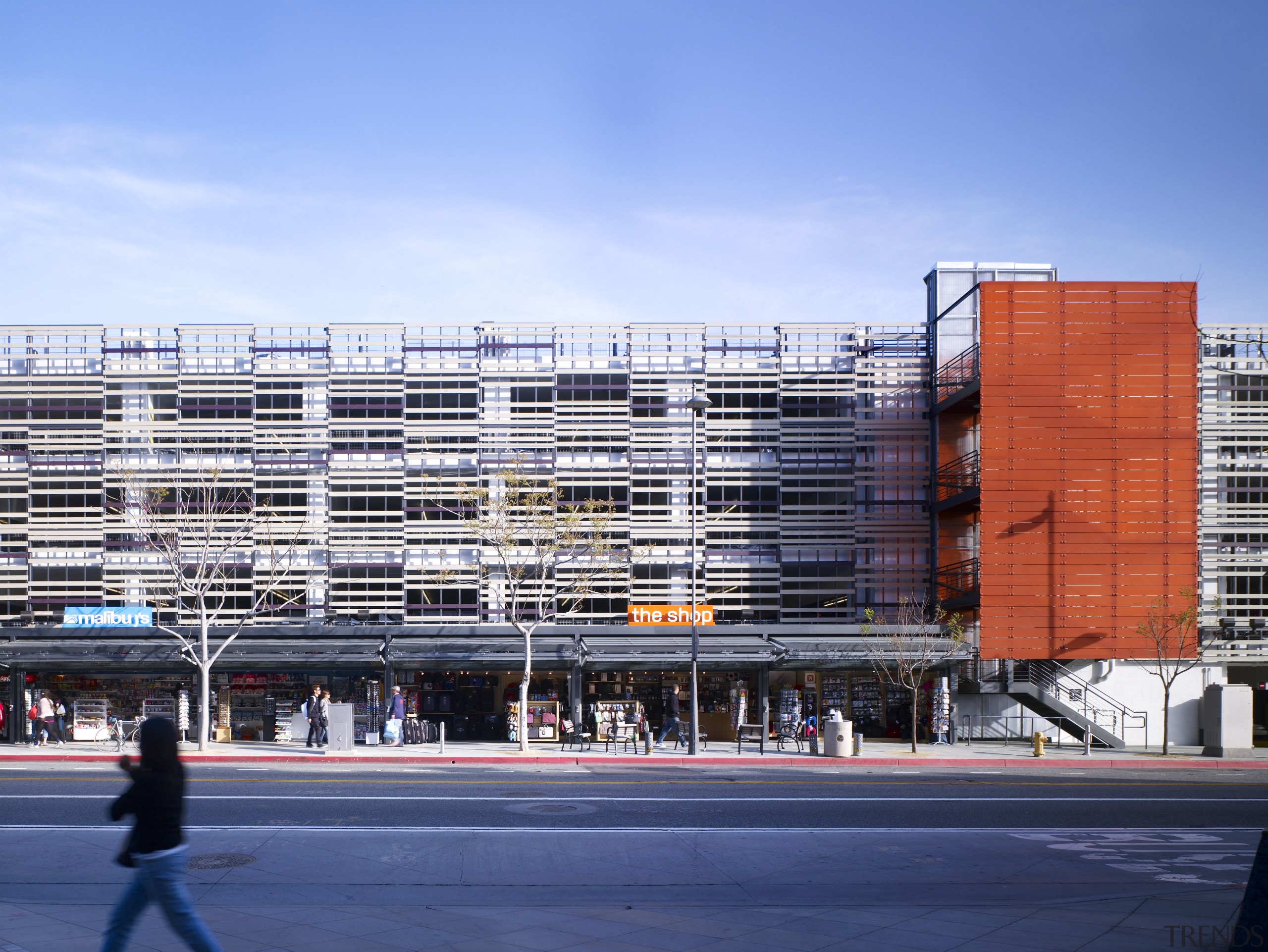 View of parking garage from street level. - architecture, building, city, commercial building, condominium, corporate headquarters, daytime, facade, headquarters, metropolis, metropolitan area, mixed use, neighbourhood, residential area, sky, structure, tower block, urban area, teal, blue