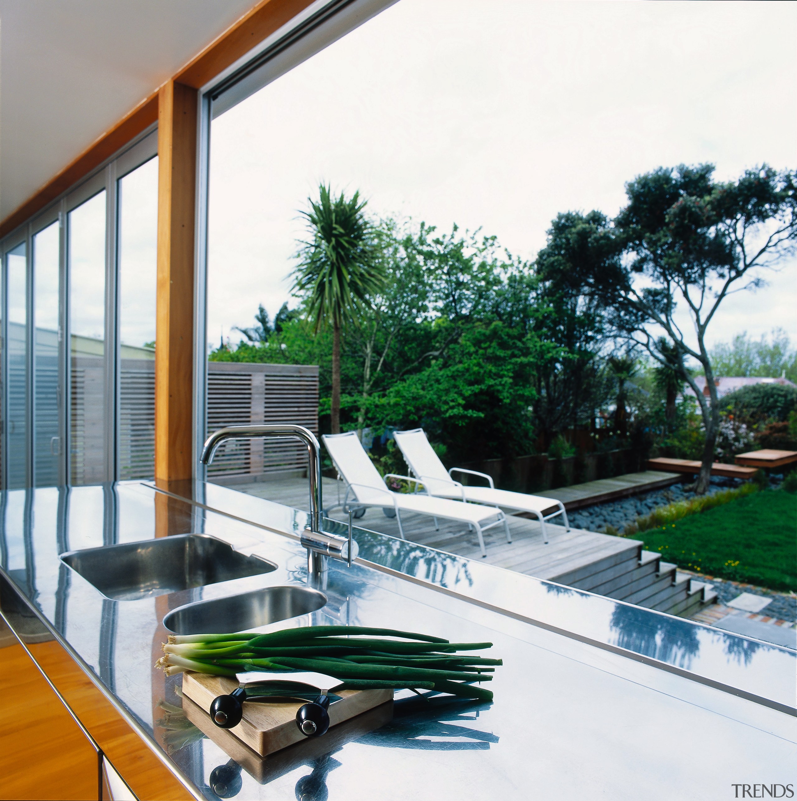 view of kitchen bench looking out into the architecture, condominium, estate, house, property, real estate, swimming pool, window, white