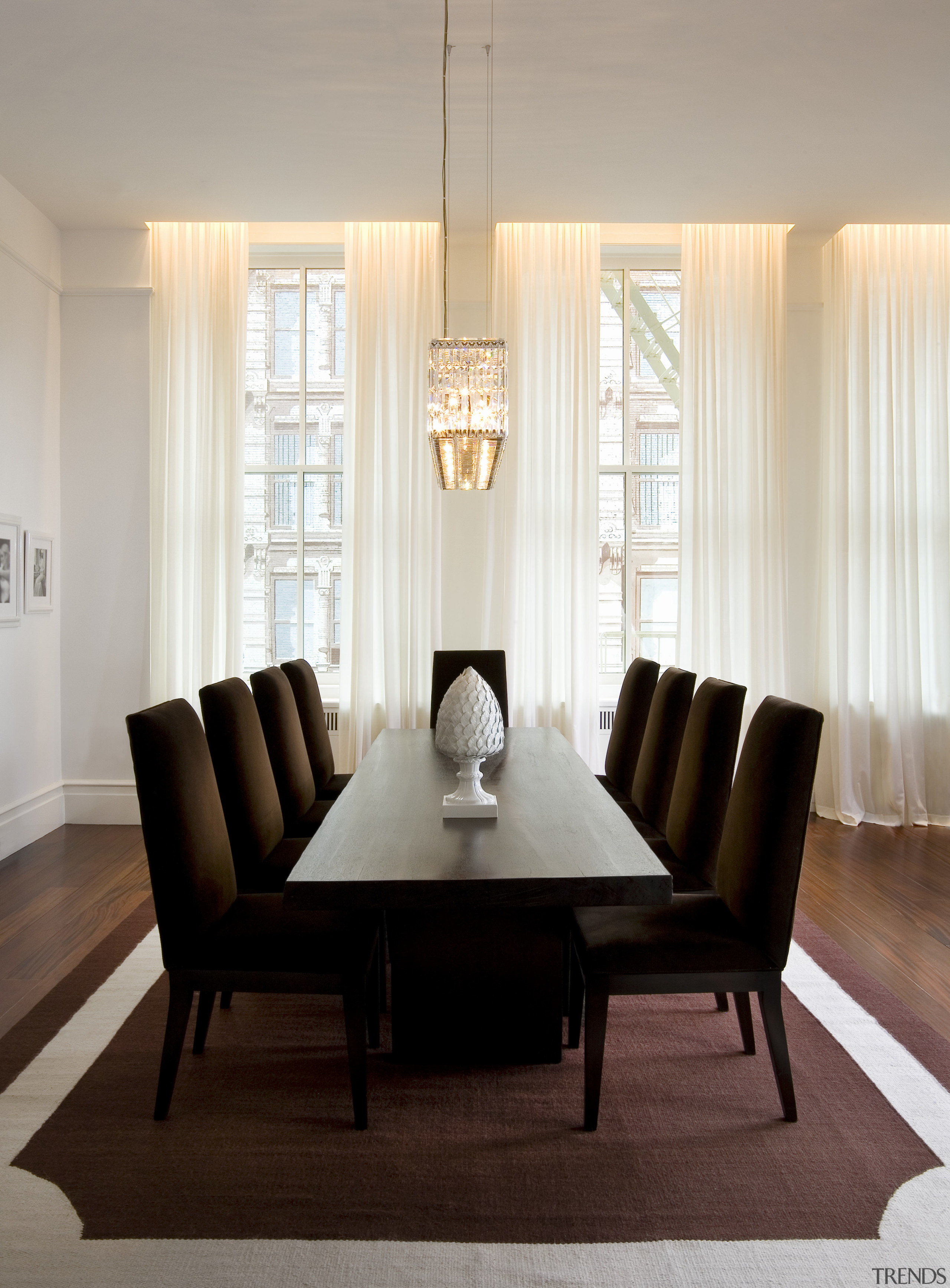 View of dining room featuring a table by ceiling, chair, curtain, dining room, floor, flooring, furniture, home, interior design, living room, room, table, window, window covering, window treatment, gray