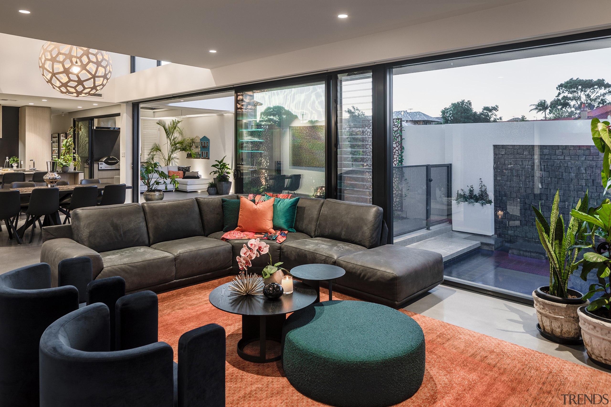 A custom rug helps organise the living area. 