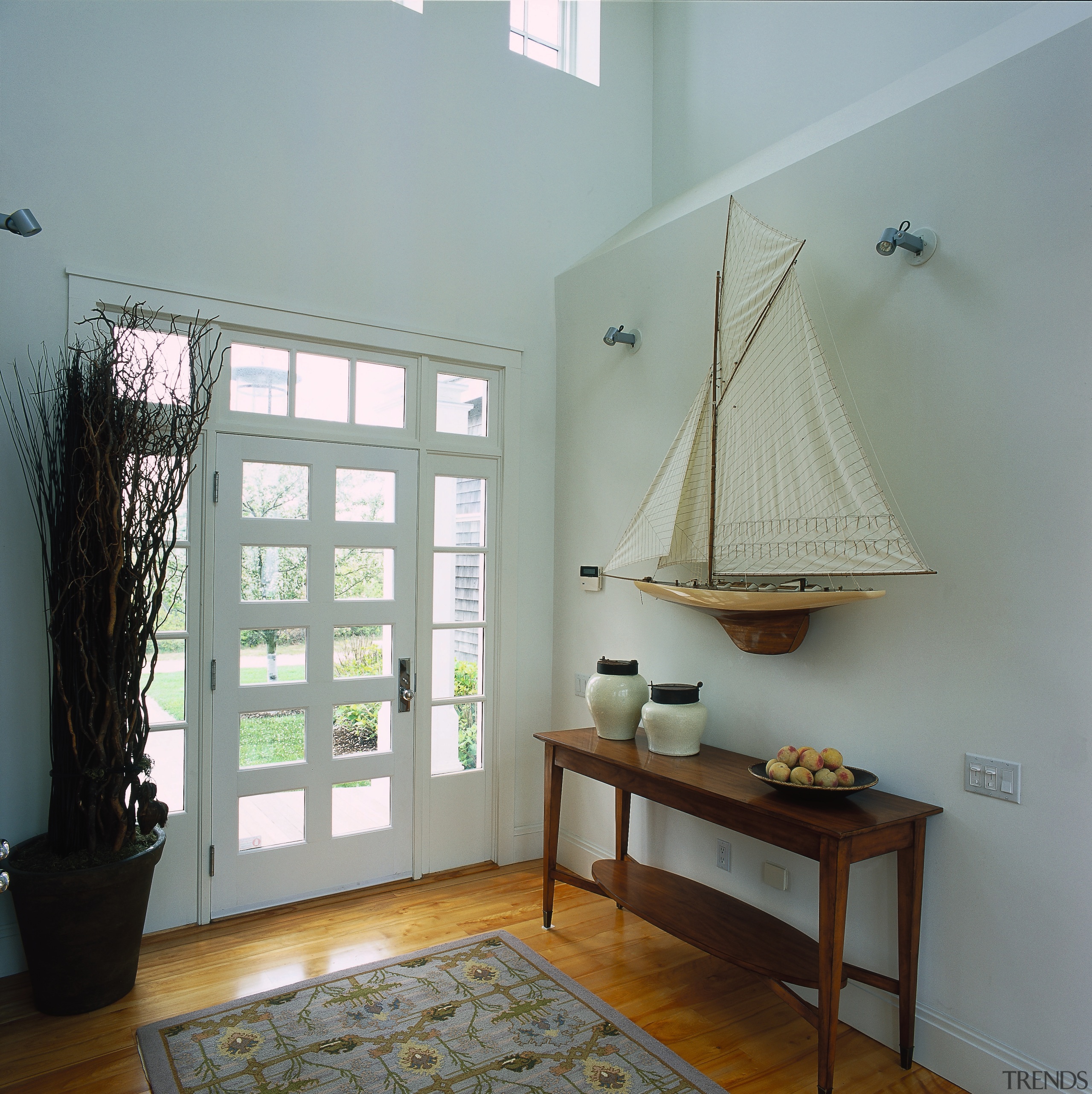 View of the front entrance of this traditional ceiling, daylighting, floor, furniture, home, house, interior design, real estate, room, wall, window, wood, gray